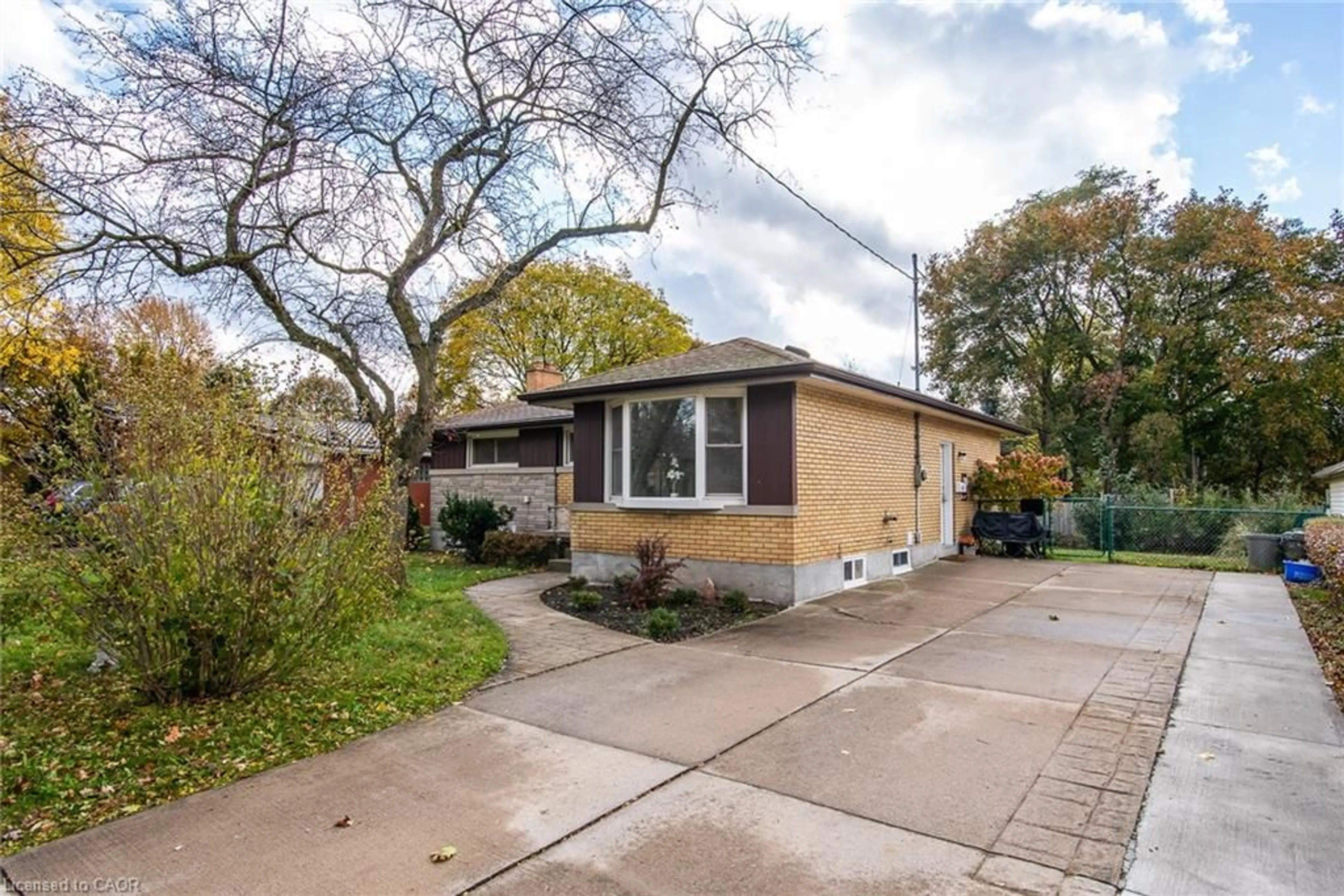 Home with brick exterior material, street for 63 Ellis Cres, Waterloo Ontario N2J 2B5