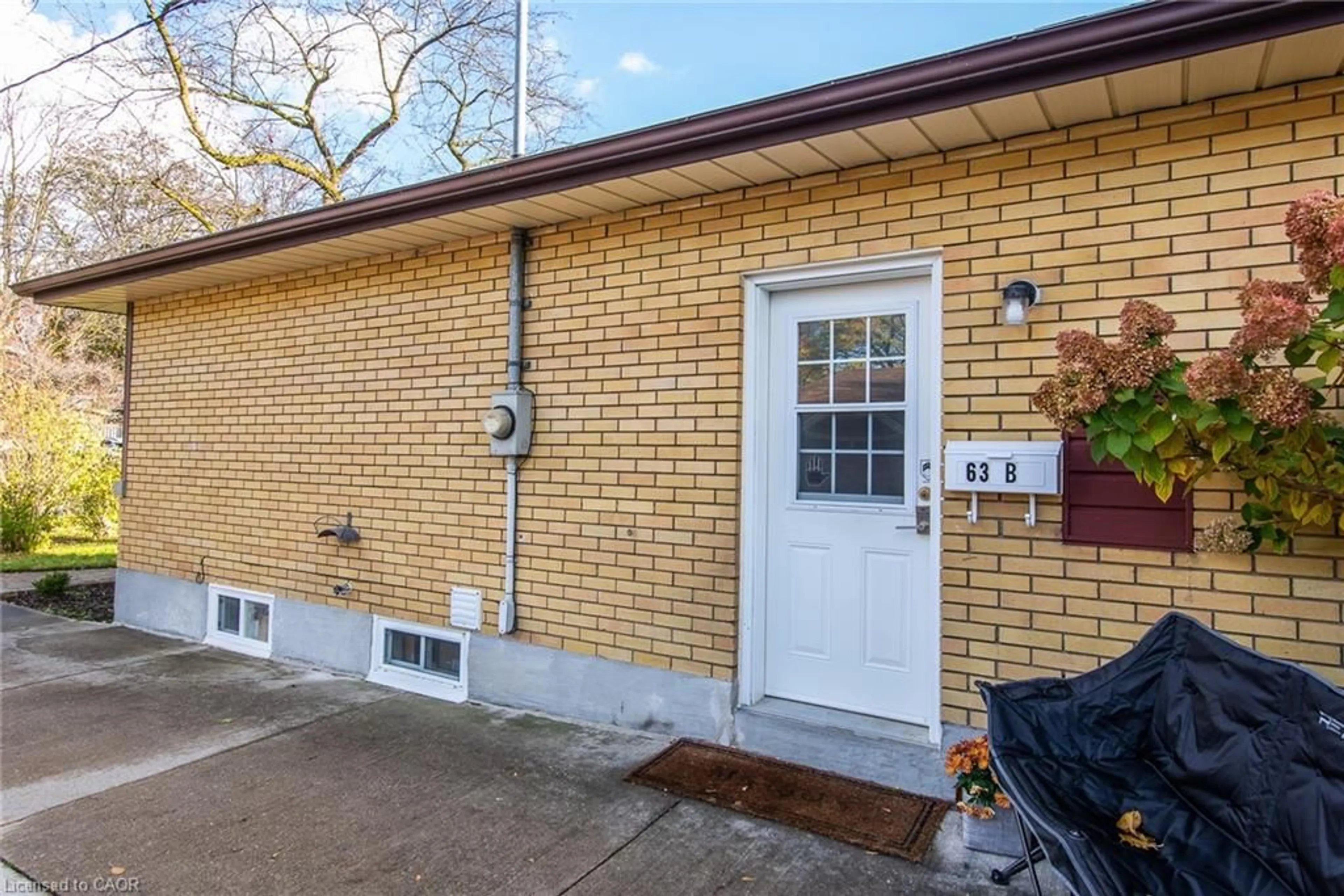 Home with brick exterior material, street for 63 Ellis Cres, Waterloo Ontario N2J 2B5