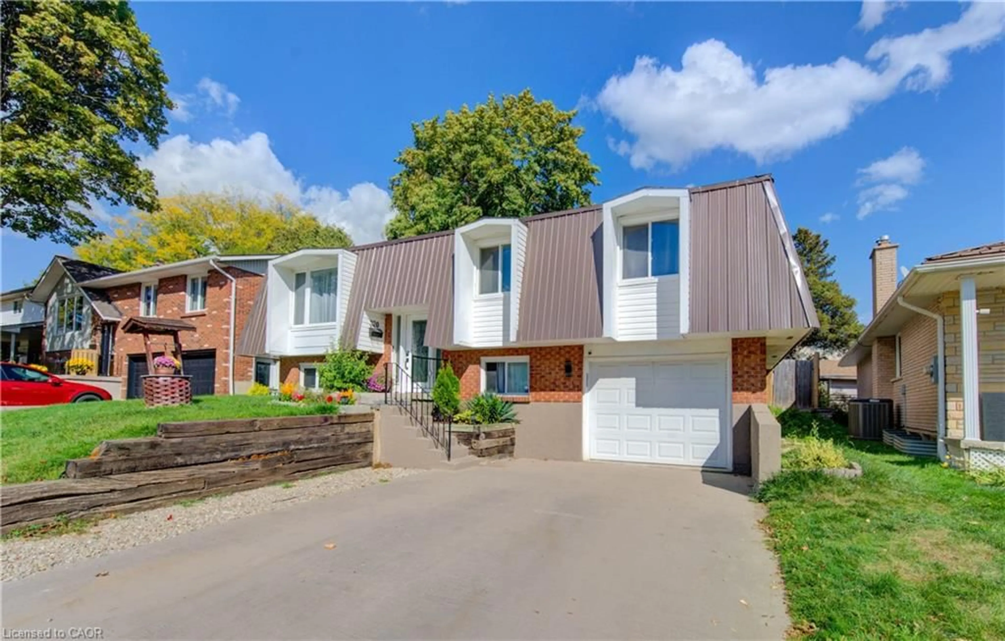 Home with brick exterior material, street for 320 Country Hill Dr, Kitchener Ontario N2E 2C2