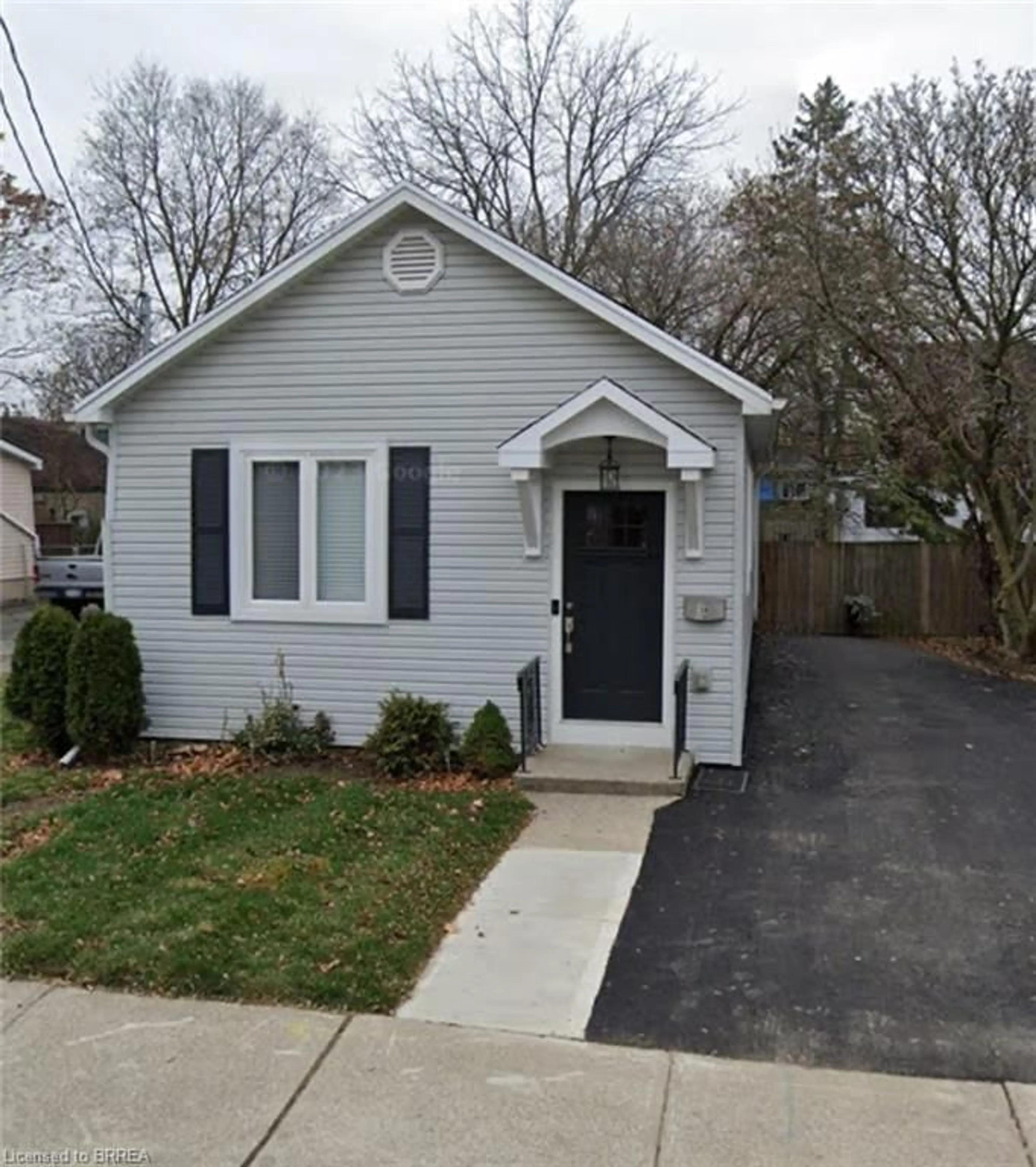 Home with vinyl exterior material, street for 14 Spring St, Brantford Ontario N3T 4M3