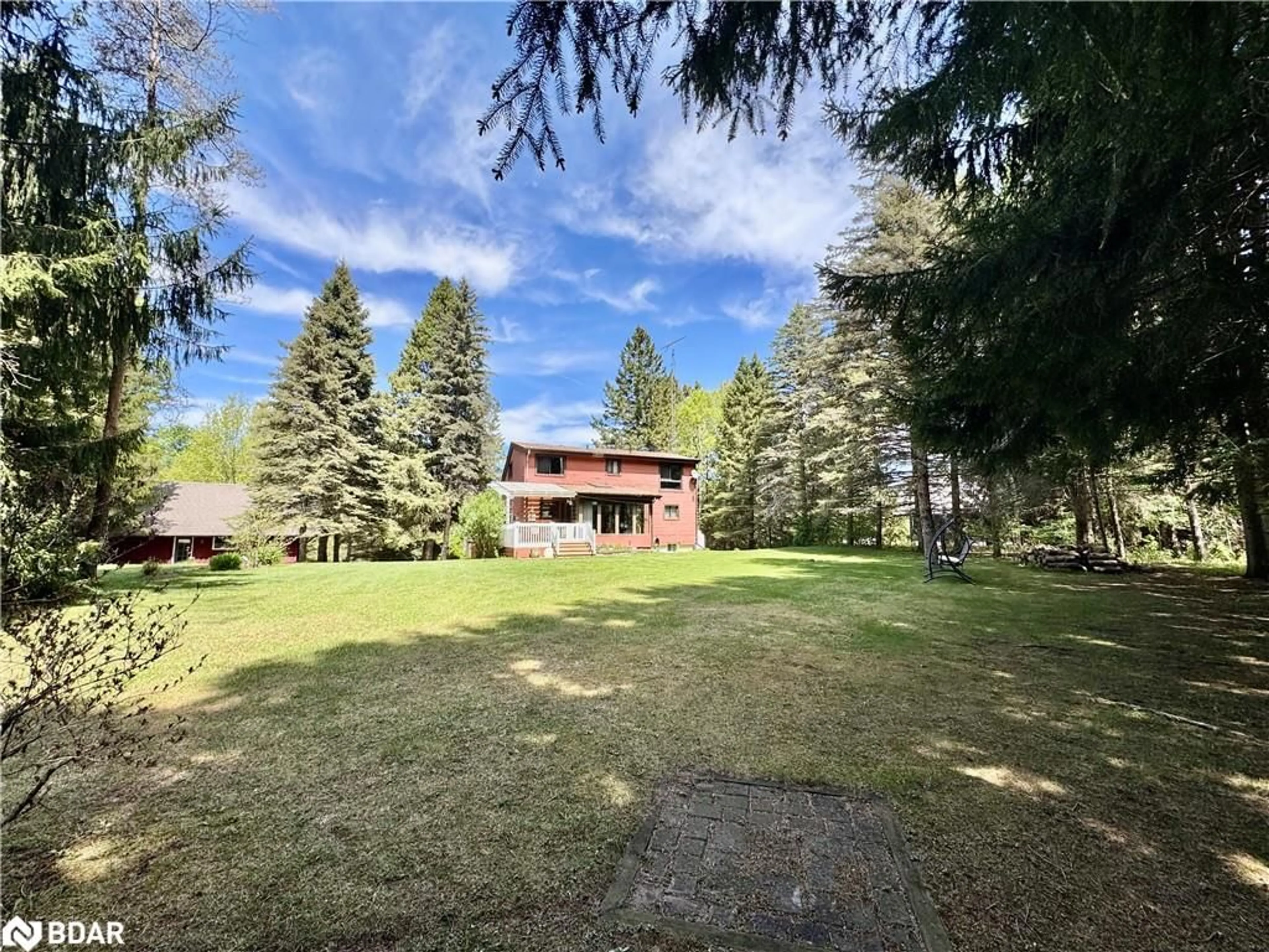 A pic from outside/outdoor area/front of a property/back of a property/a pic from drone, forest/trees view for 8 Pine River Cres, Mulmur Ontario L9V 3H2