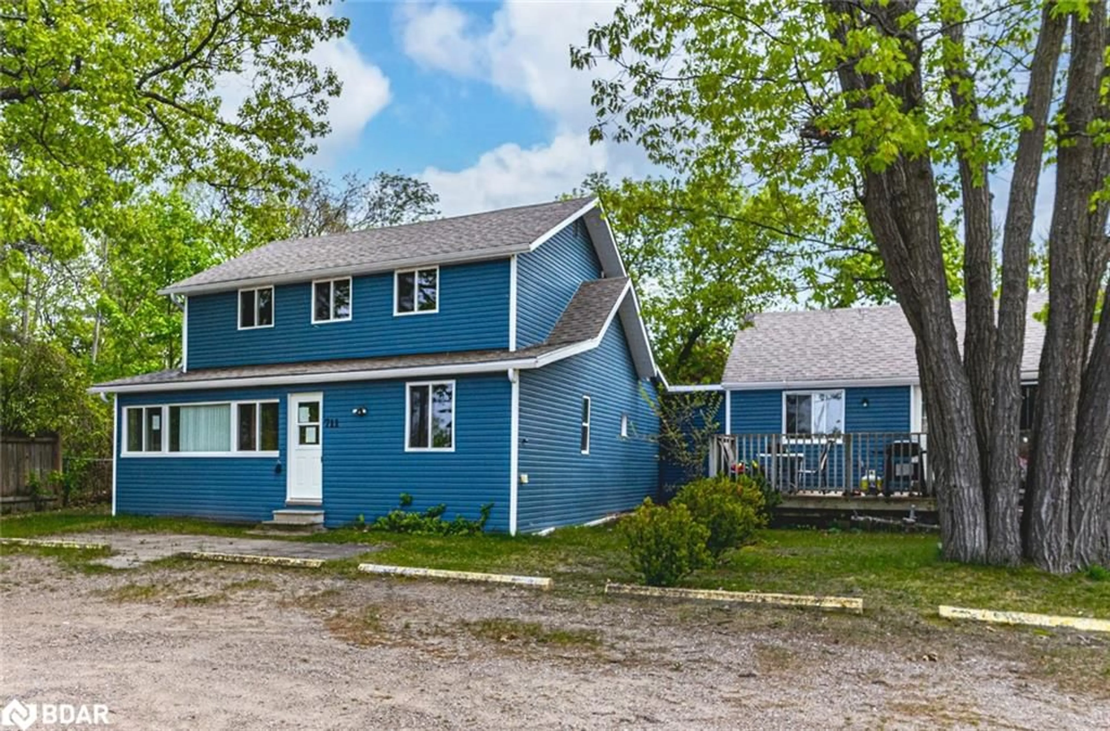 A pic from outside/outdoor area/front of a property/back of a property/a pic from drone, street for 711 Mosley St, Wasaga Beach Ontario L9Z 1Z5
