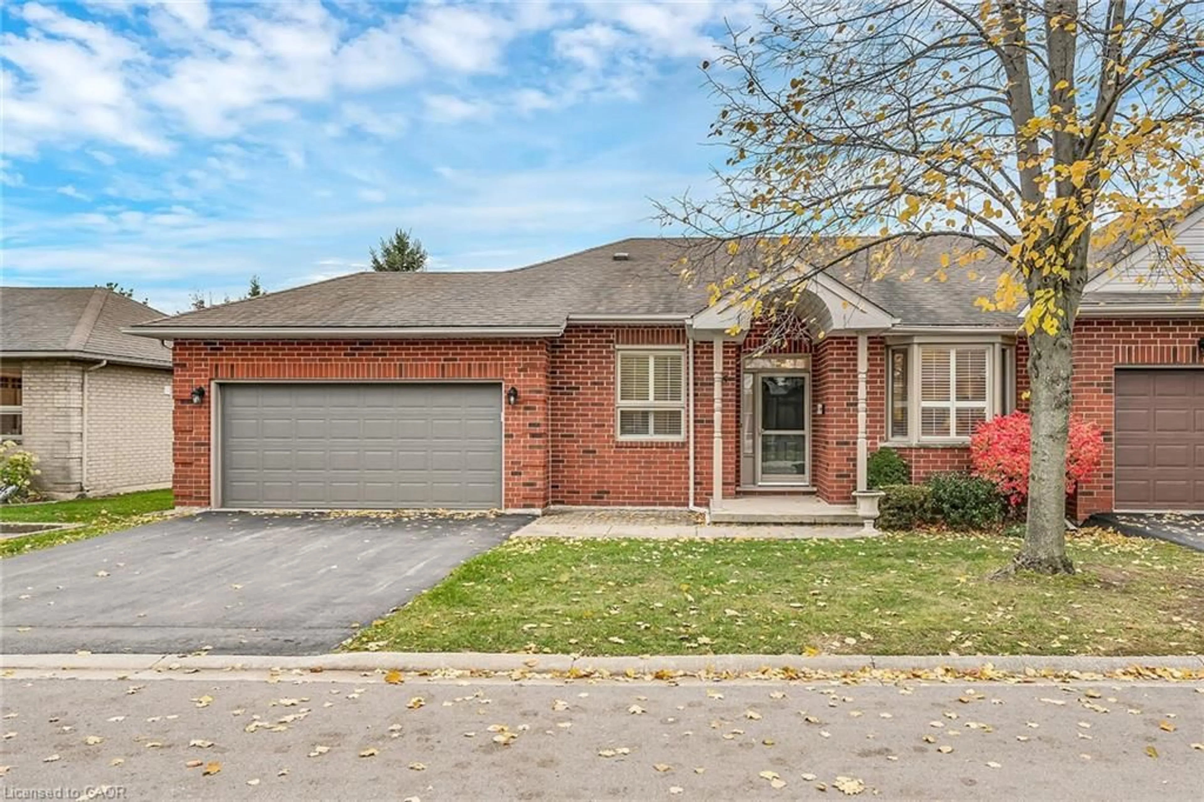 Home with brick exterior material, street for 55 Riveroaks Dr, Mount Hope Ontario L0R 1W0
