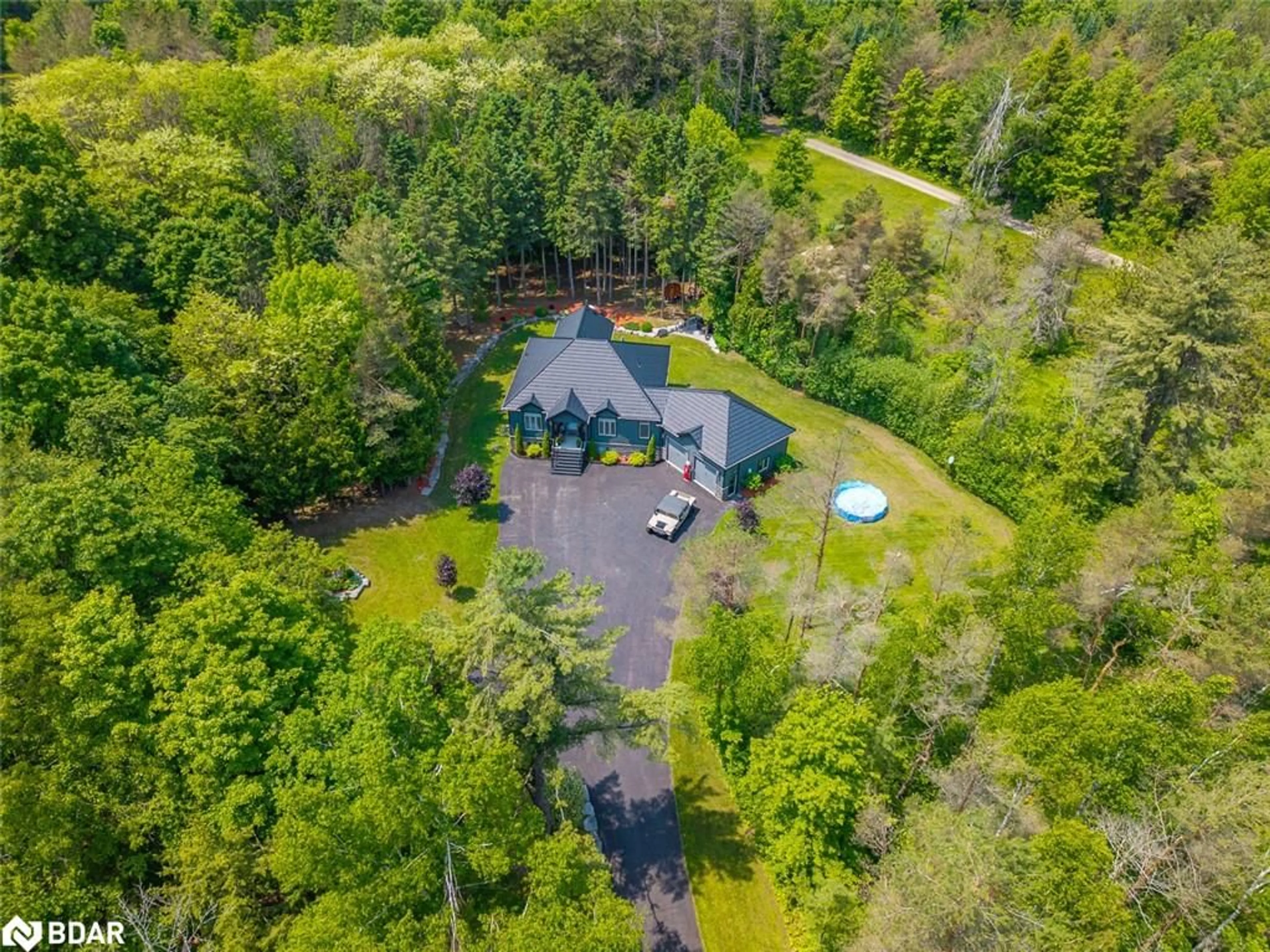 A pic from outside/outdoor area/front of a property/back of a property/a pic from drone, forest/trees view for 7070 93 Hwy, Tiny Ontario L0K 2E0