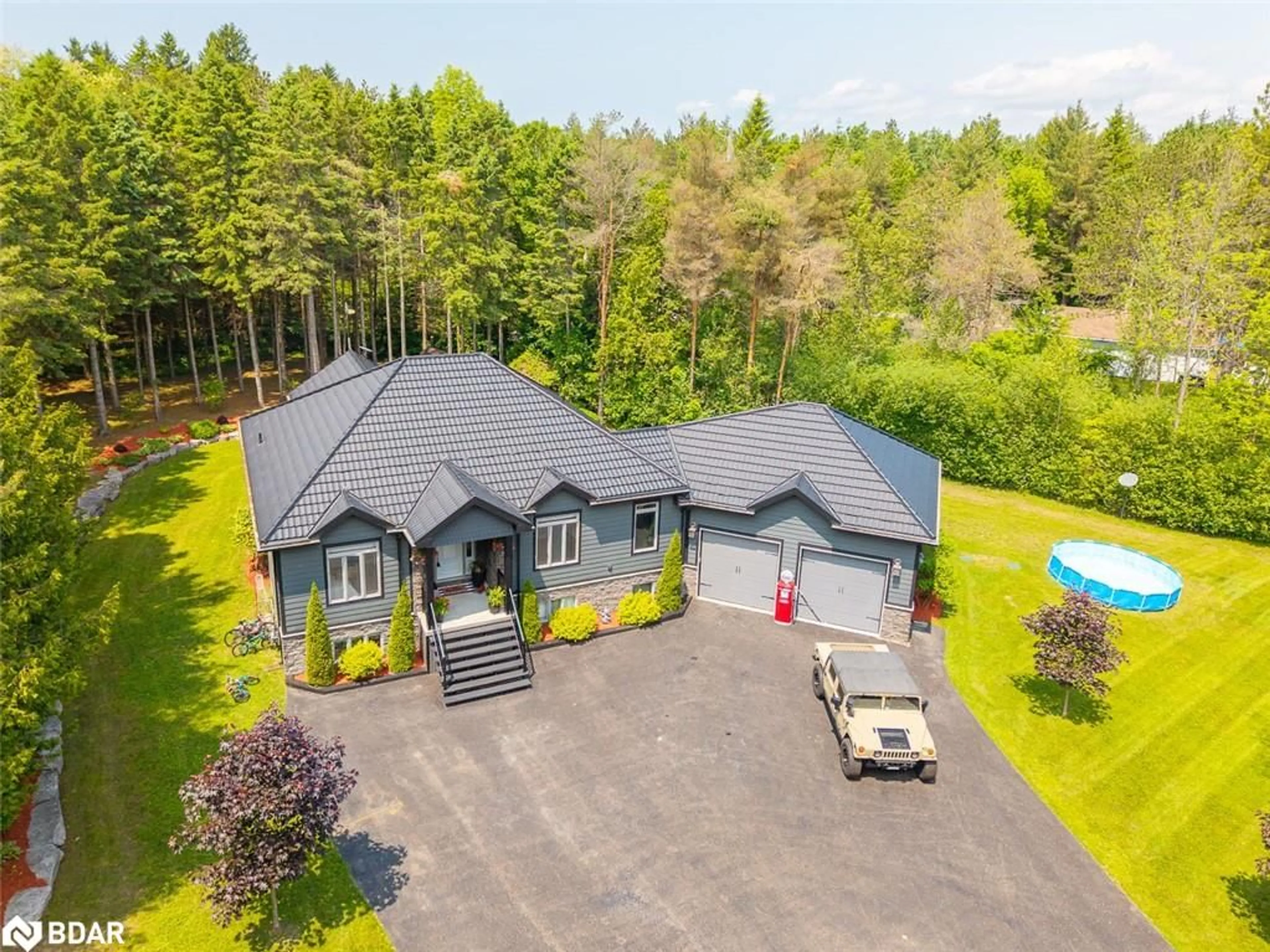 A pic from outside/outdoor area/front of a property/back of a property/a pic from drone, unknown for 7070 93 Hwy, Tiny Ontario L0K 2E0