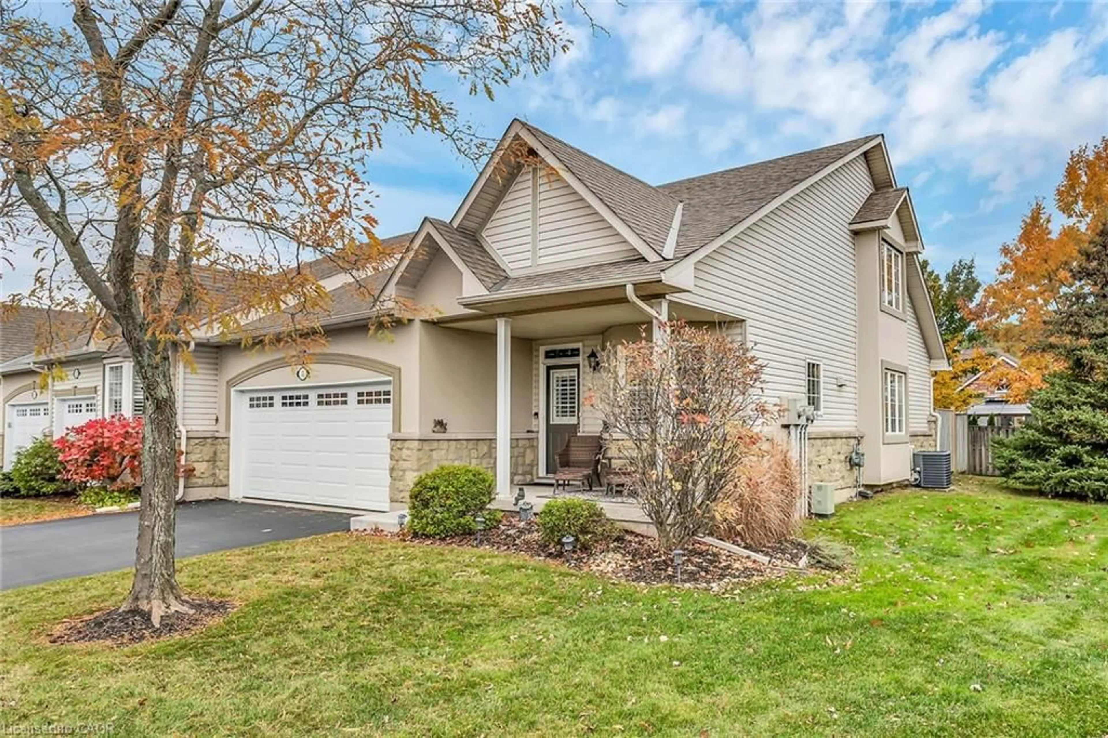 Home with vinyl exterior material, street for 212 Stonehenge Dr #31, Ancaster Ontario L9K 1N5