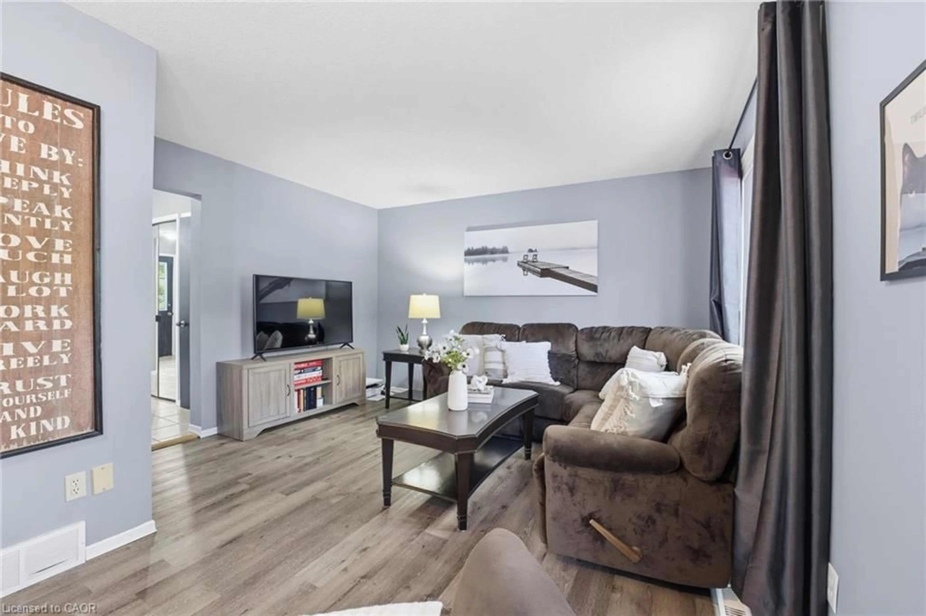 Living room with furniture, wood/laminate floor for 445 Kingscourt Dr #6, Waterloo Ontario N2K 3R4