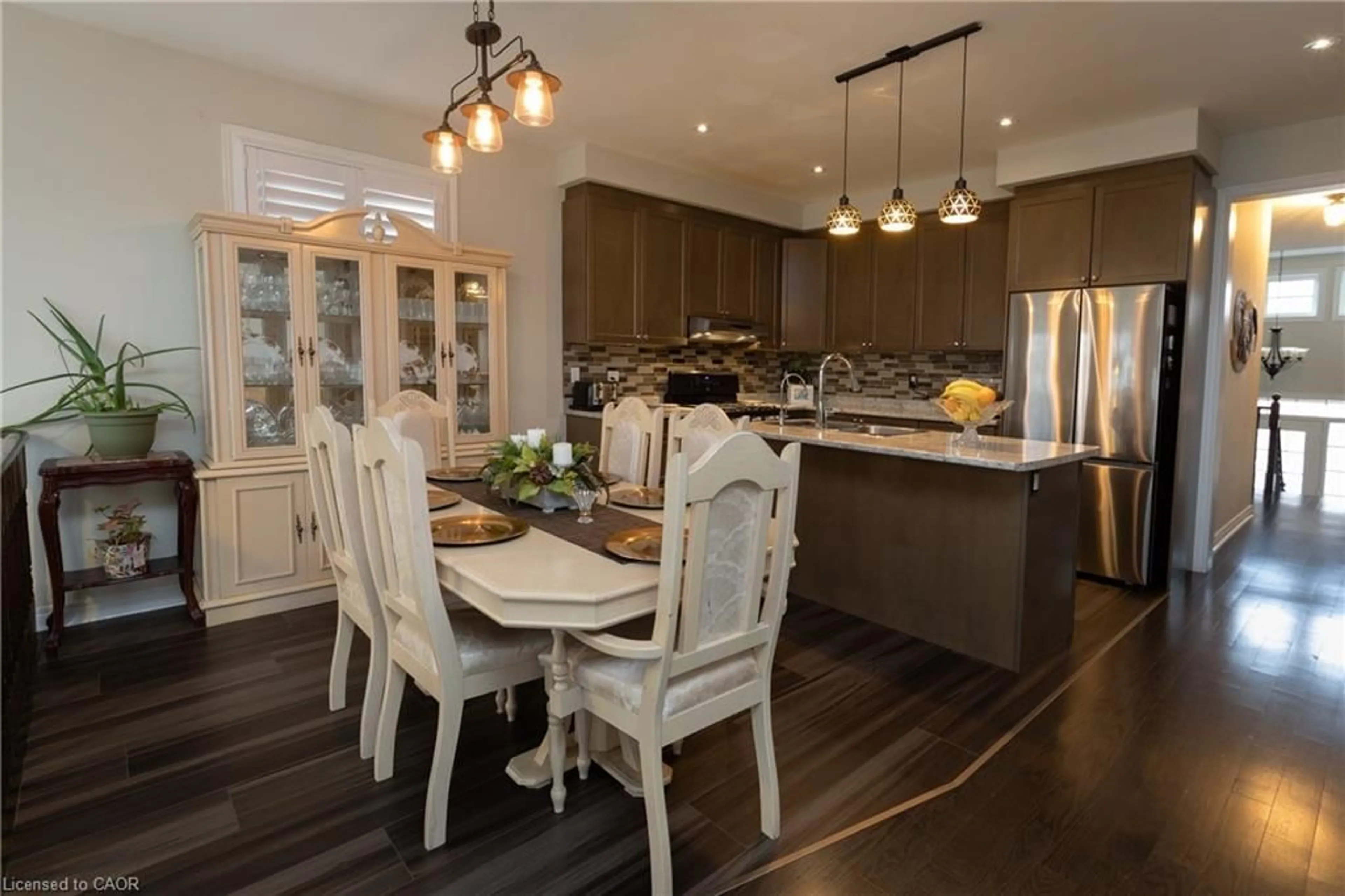 Open concept kitchen, wood/laminate floor for 1024 Upper Thames Drive Dr, Woodstock Ontario N4T 0H4