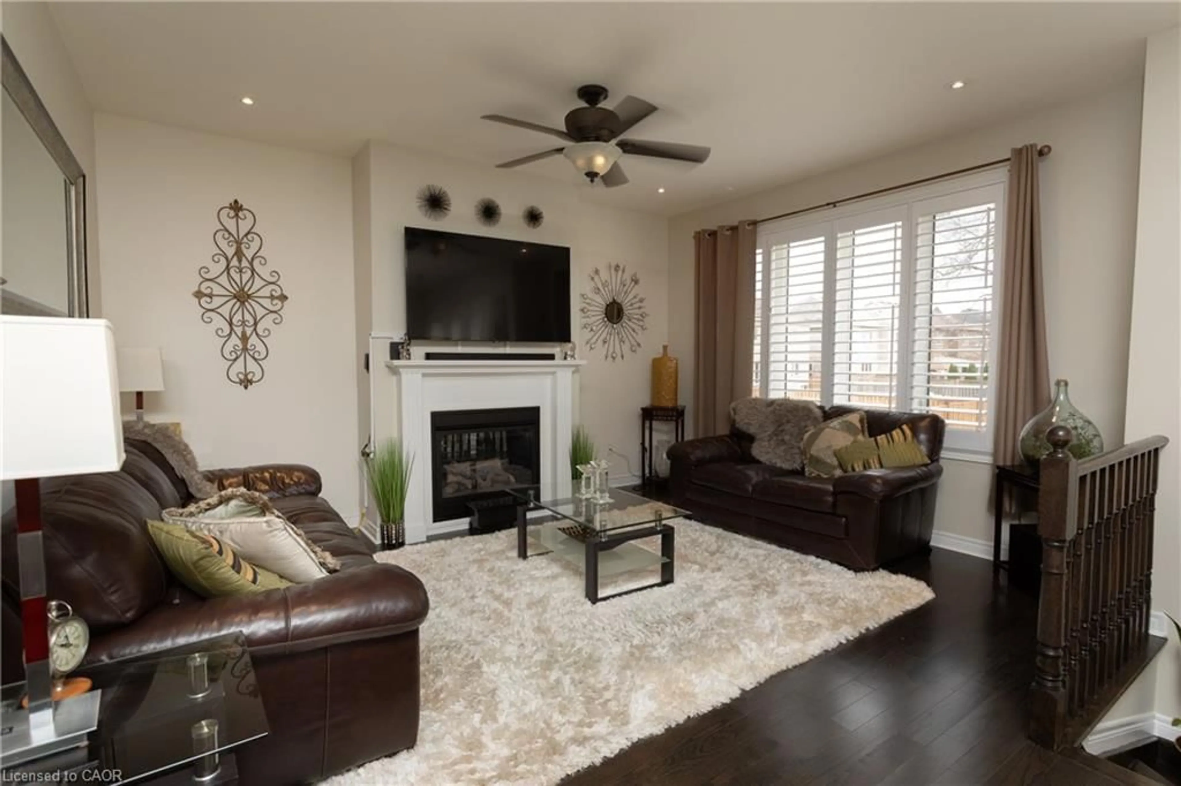 Living room with furniture, wood/laminate floor for 1024 Upper Thames Drive Dr, Woodstock Ontario N4T 0H4