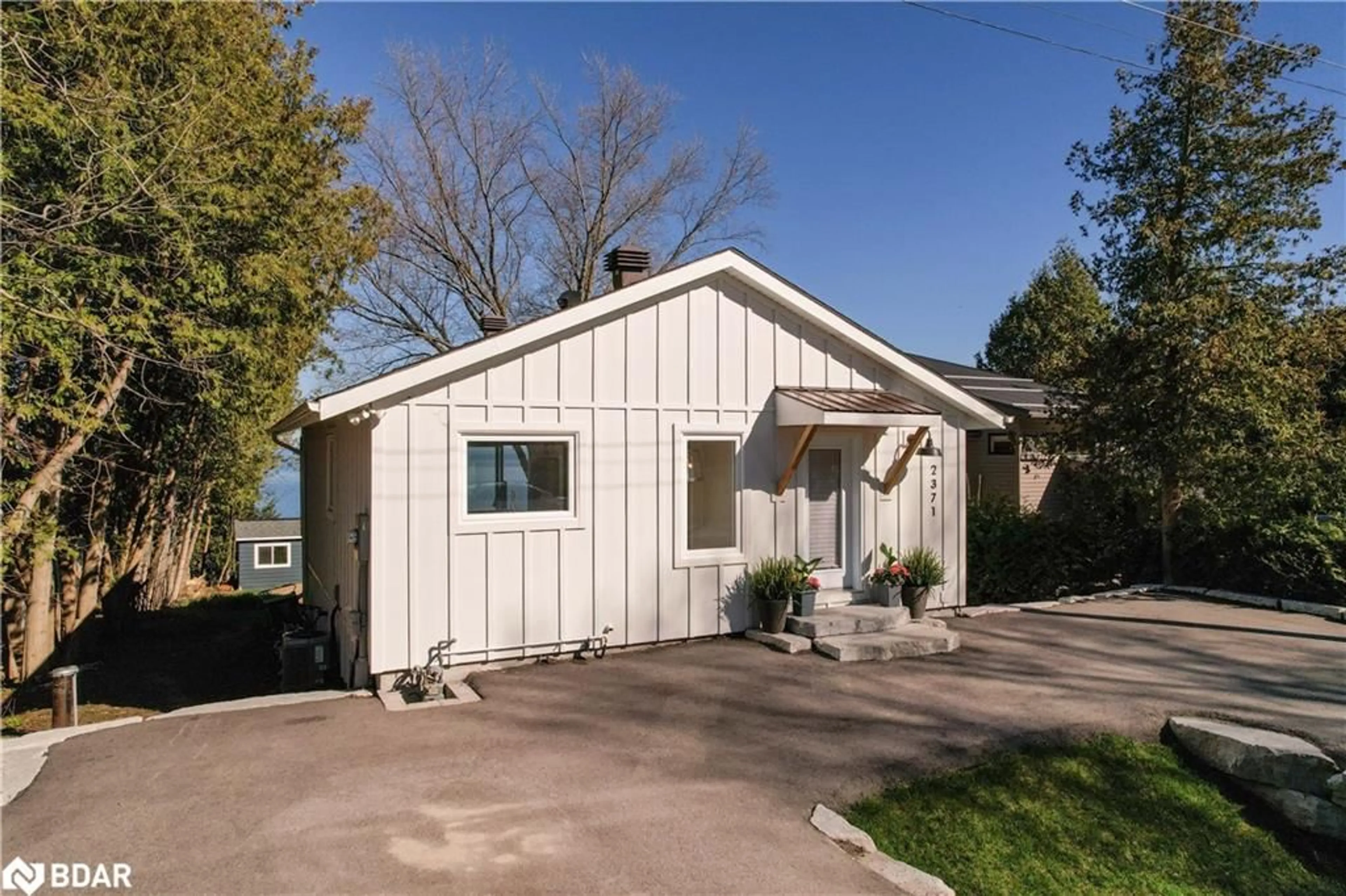 Home with vinyl exterior material, street for 2371 Lakeshore Rd, Oro-Medonte Ontario L0L 1T0