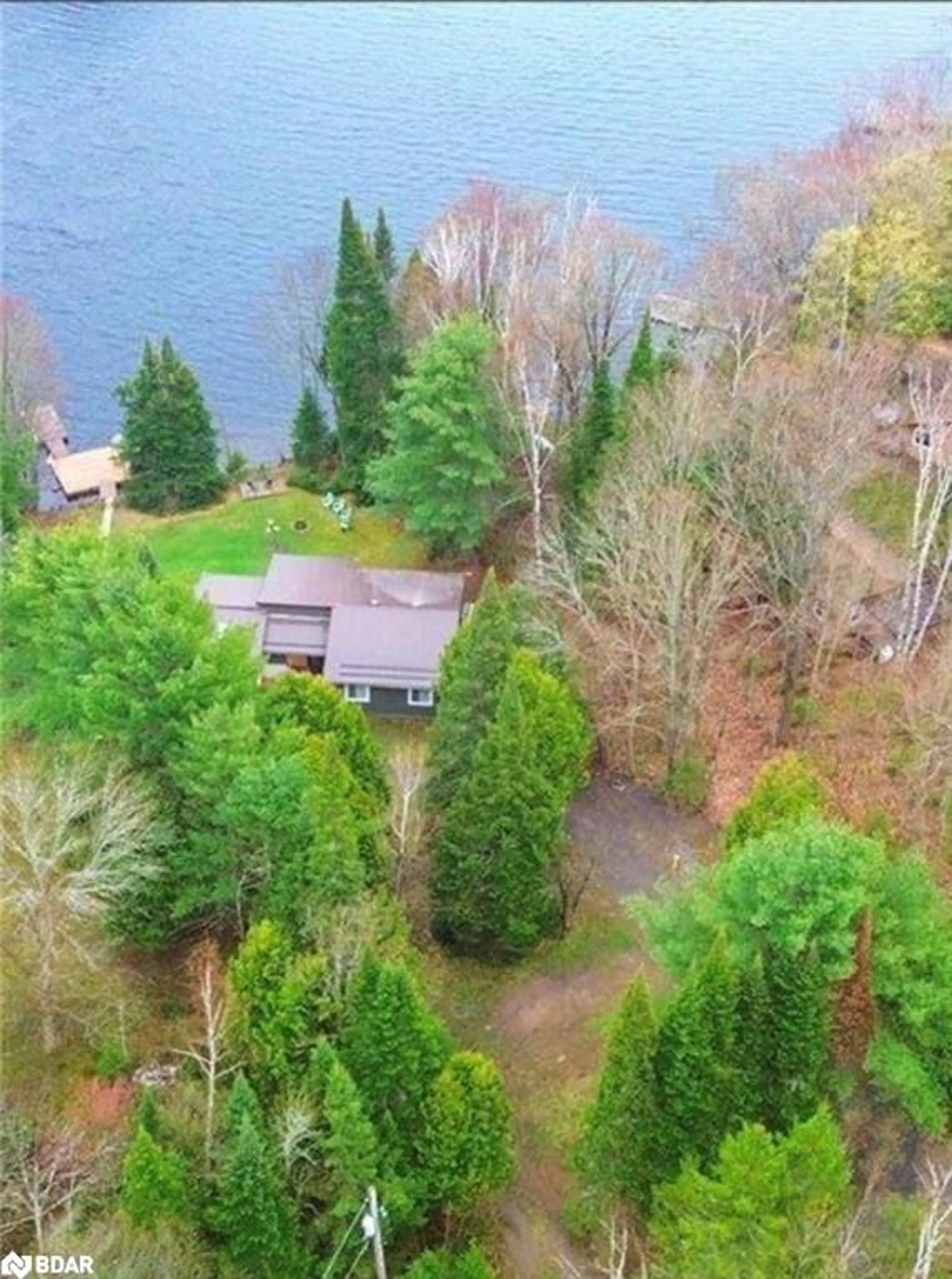 A pic from outside/outdoor area/front of a property/back of a property/a pic from drone, water/lake/river/ocean view for 1017 Rays Lane, Minden Ontario K0M 2K0