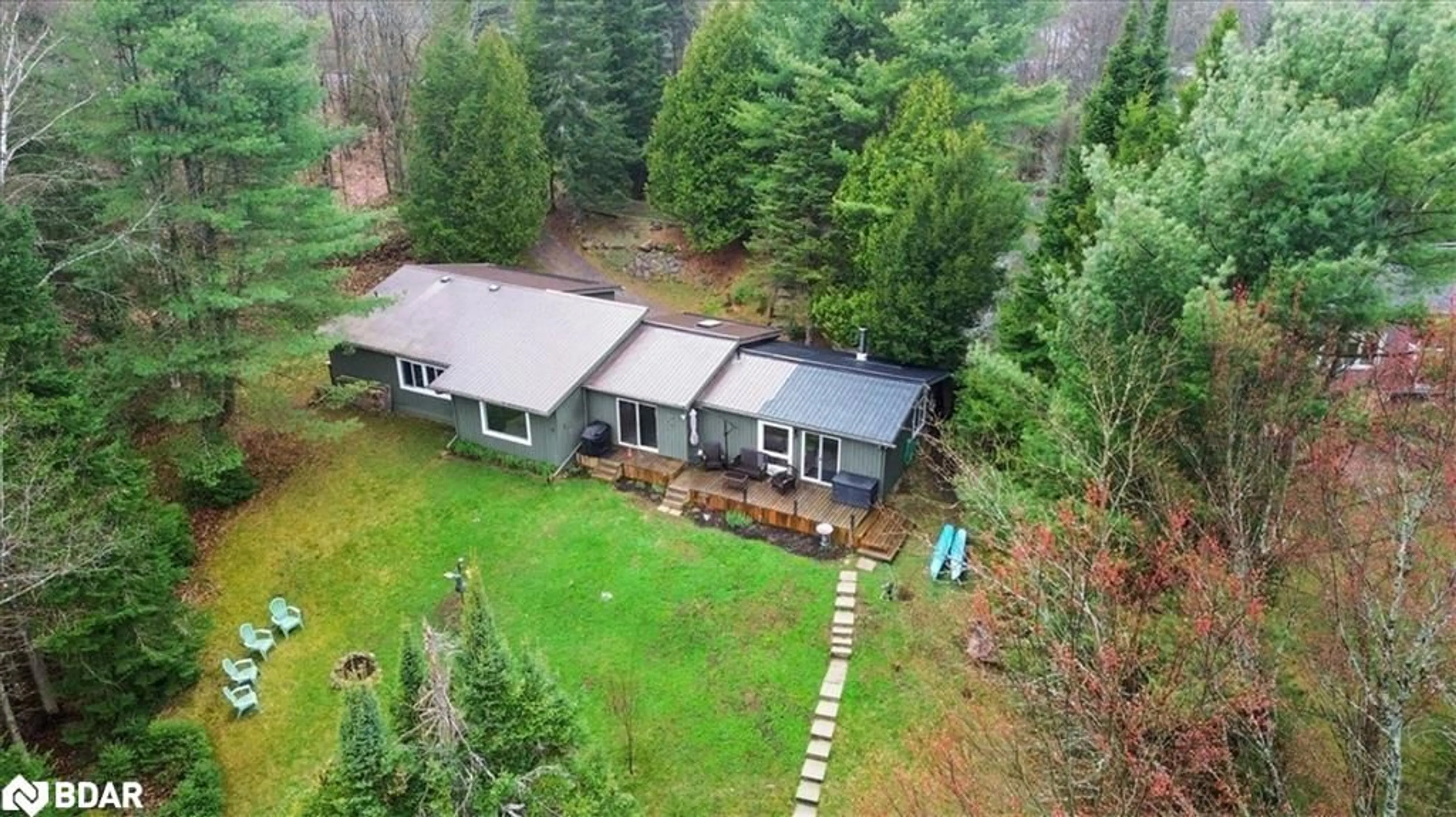 A pic from outside/outdoor area/front of a property/back of a property/a pic from drone, forest/trees view for 1017 Rays Lane, Minden Ontario K0M 2K0