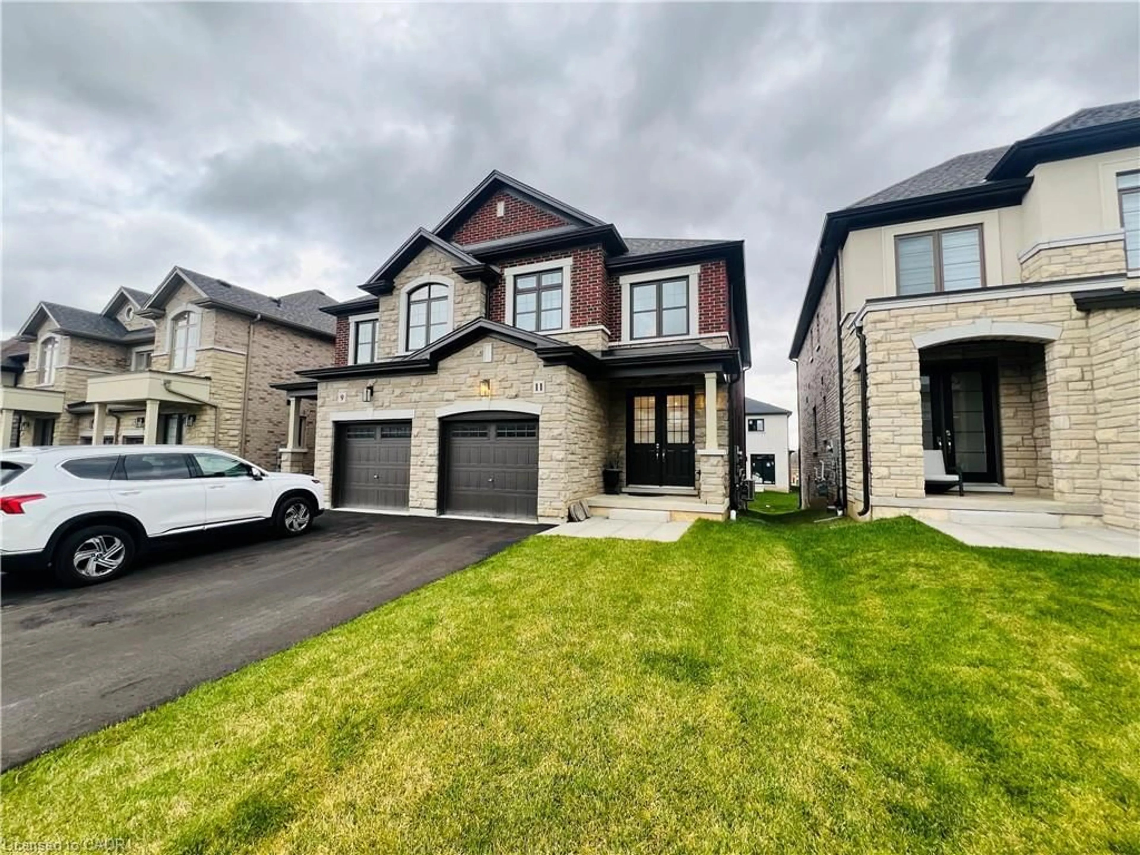 Home with brick exterior material, street for 11 Cherry Blossom Hts, Hamilton Ontario L9B 0E9