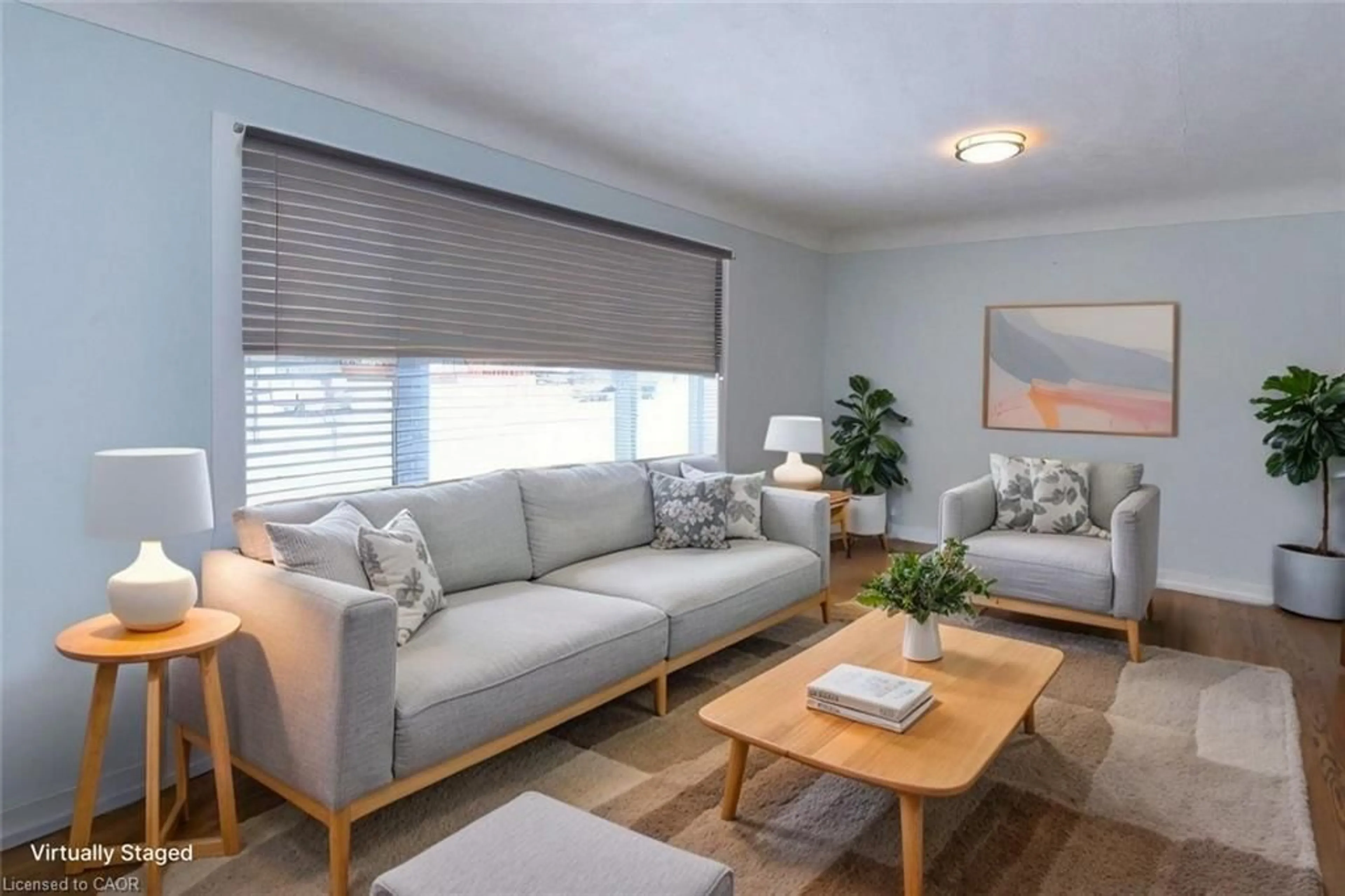 Living room with furniture, wood/laminate floor for 158 Howe Ave, Hamilton Ontario L9A 1X8