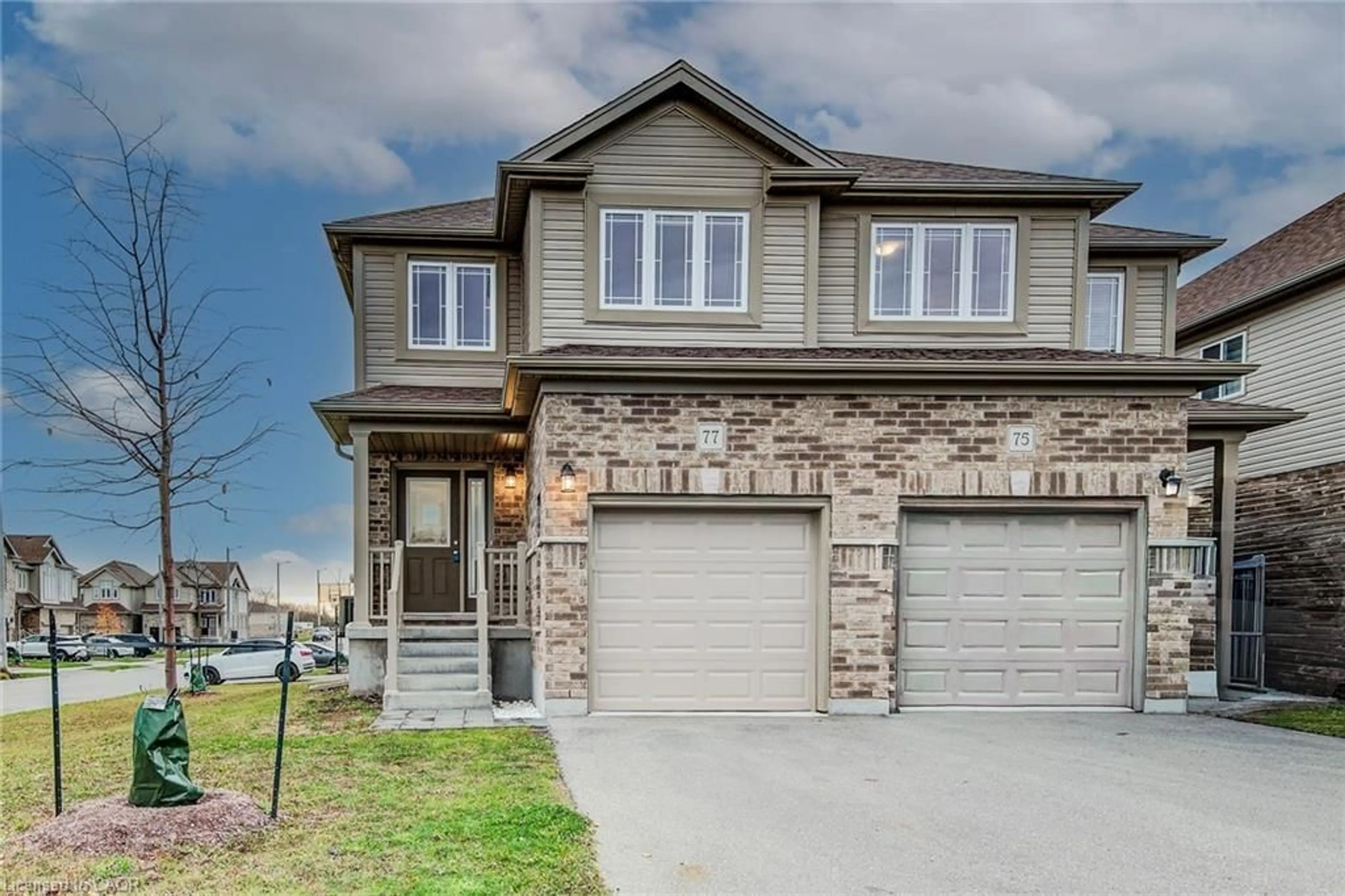 Home with brick exterior material, street for 77 John Brabson Cres, Guelph Ontario N1G 0G7