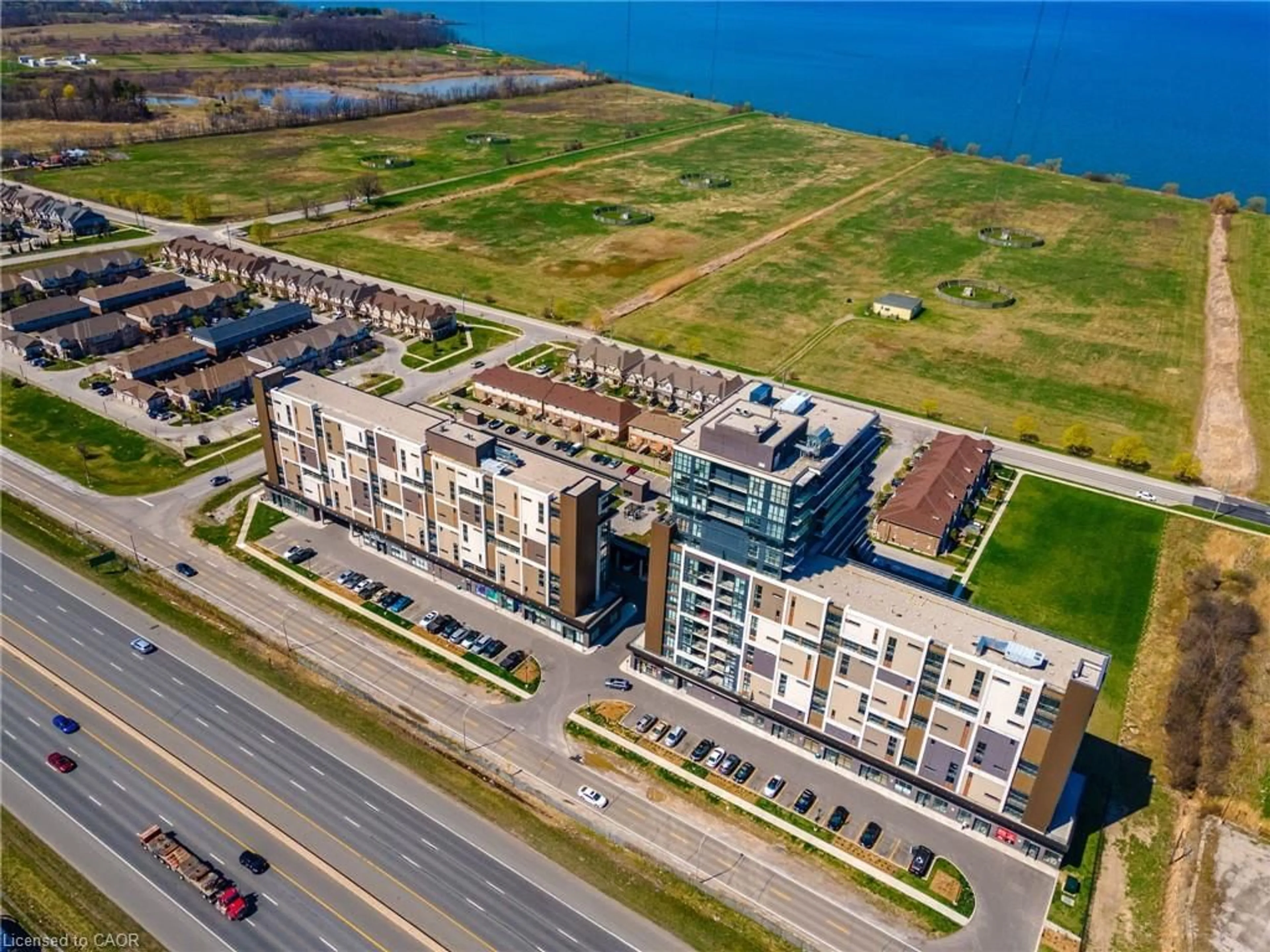 A pic from outside/outdoor area/front of a property/back of a property/a pic from drone, water/lake/river/ocean view for 550 North Service Rd #1404, Grimsby Ontario L3M 0H9