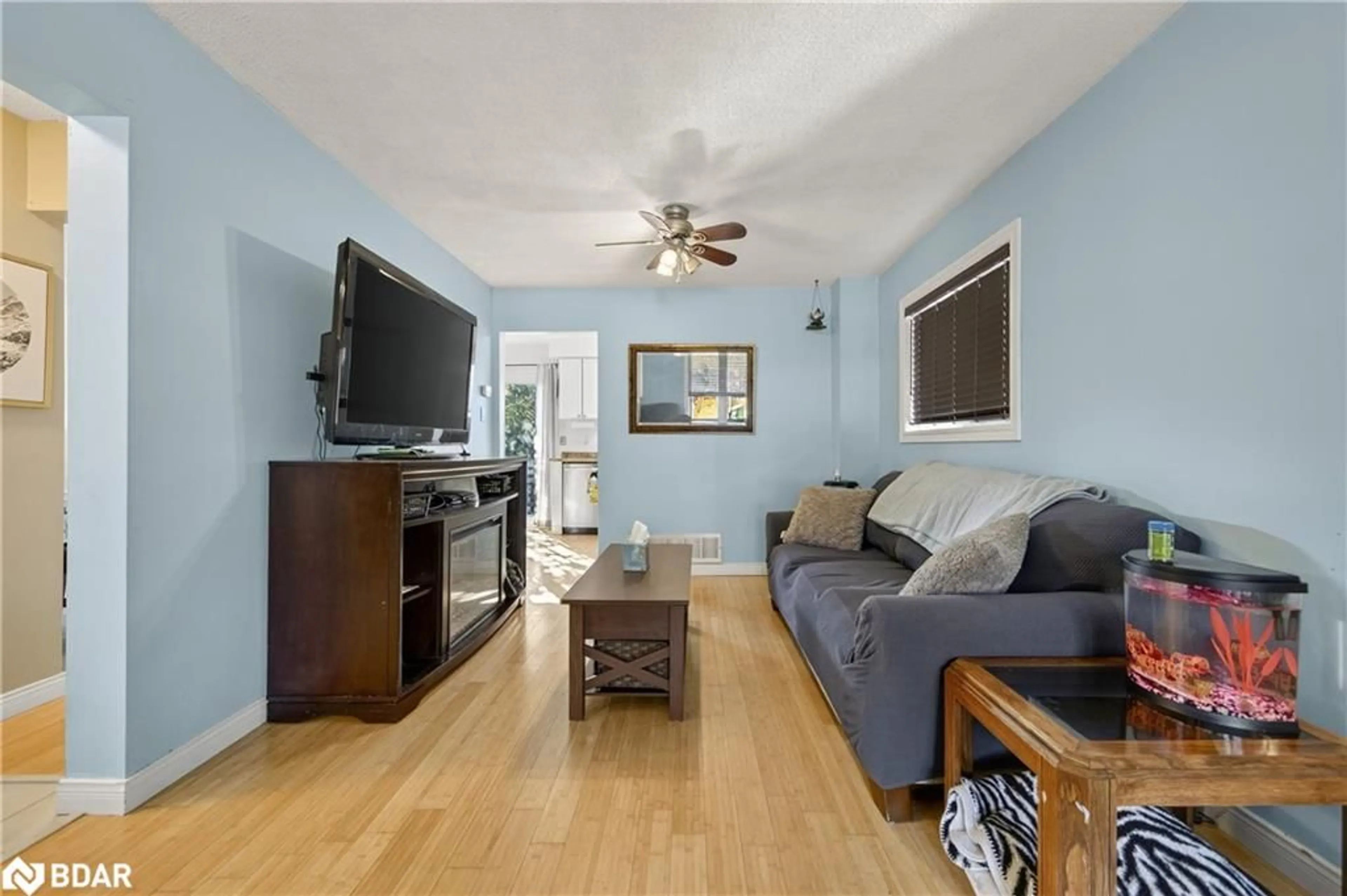 Living room with furniture, wood/laminate floor for 14 Corrie Crescent, Angus Ontario L0M 1B3