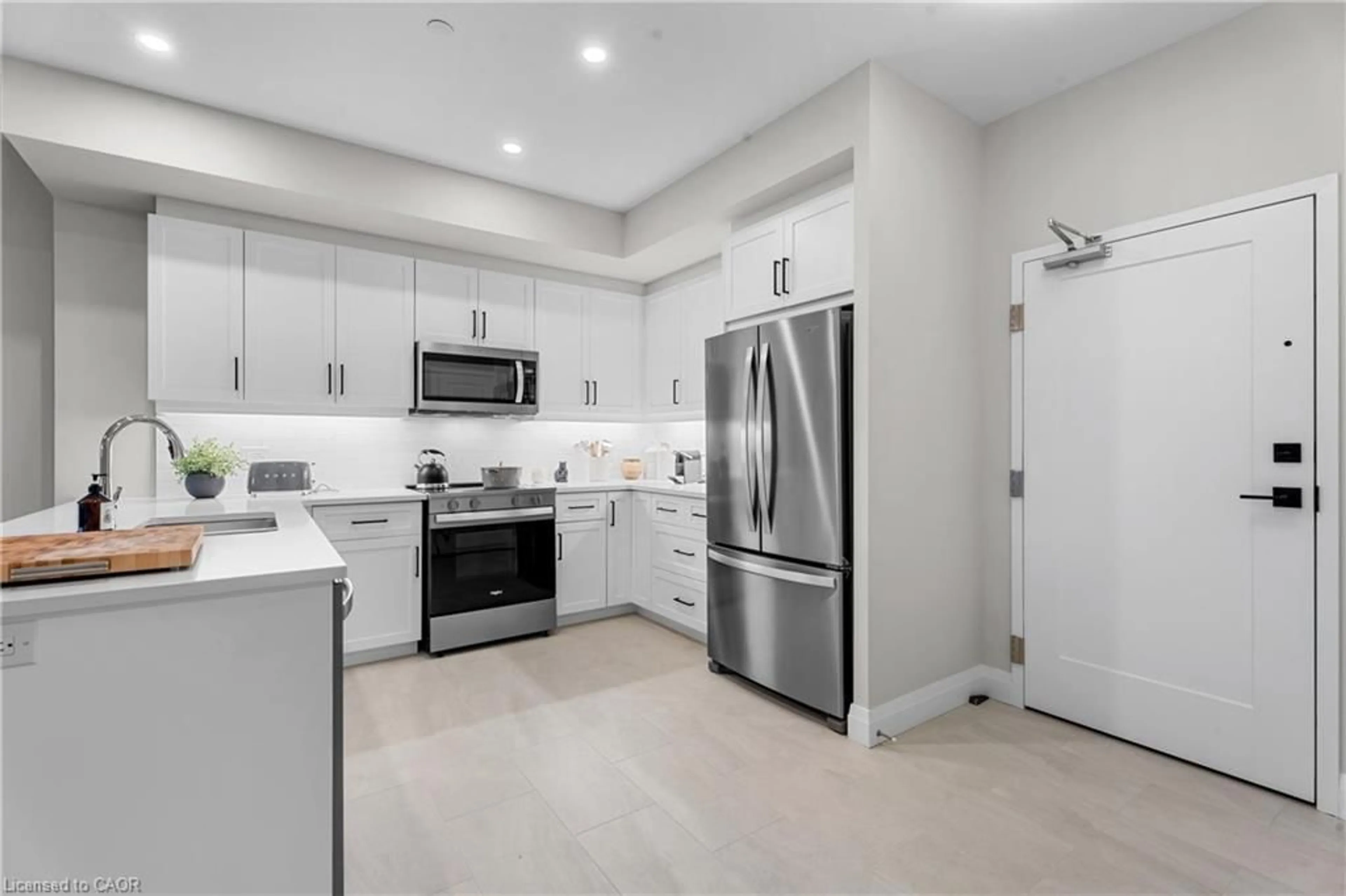 Open concept kitchen, ceramic/tile floor for 1882 Gordon St #211, Guelph Ontario N1K 0P6