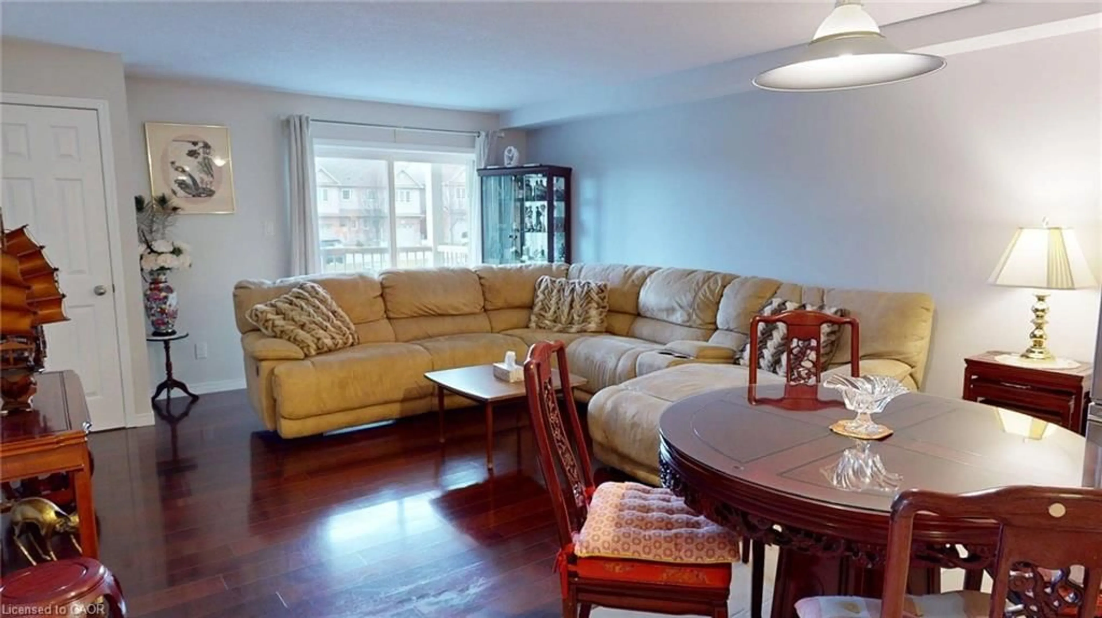 Living room with furniture, wood/laminate floor for 345 Fisher Mills Rd #103, Cambridge Ontario N3C 0E5