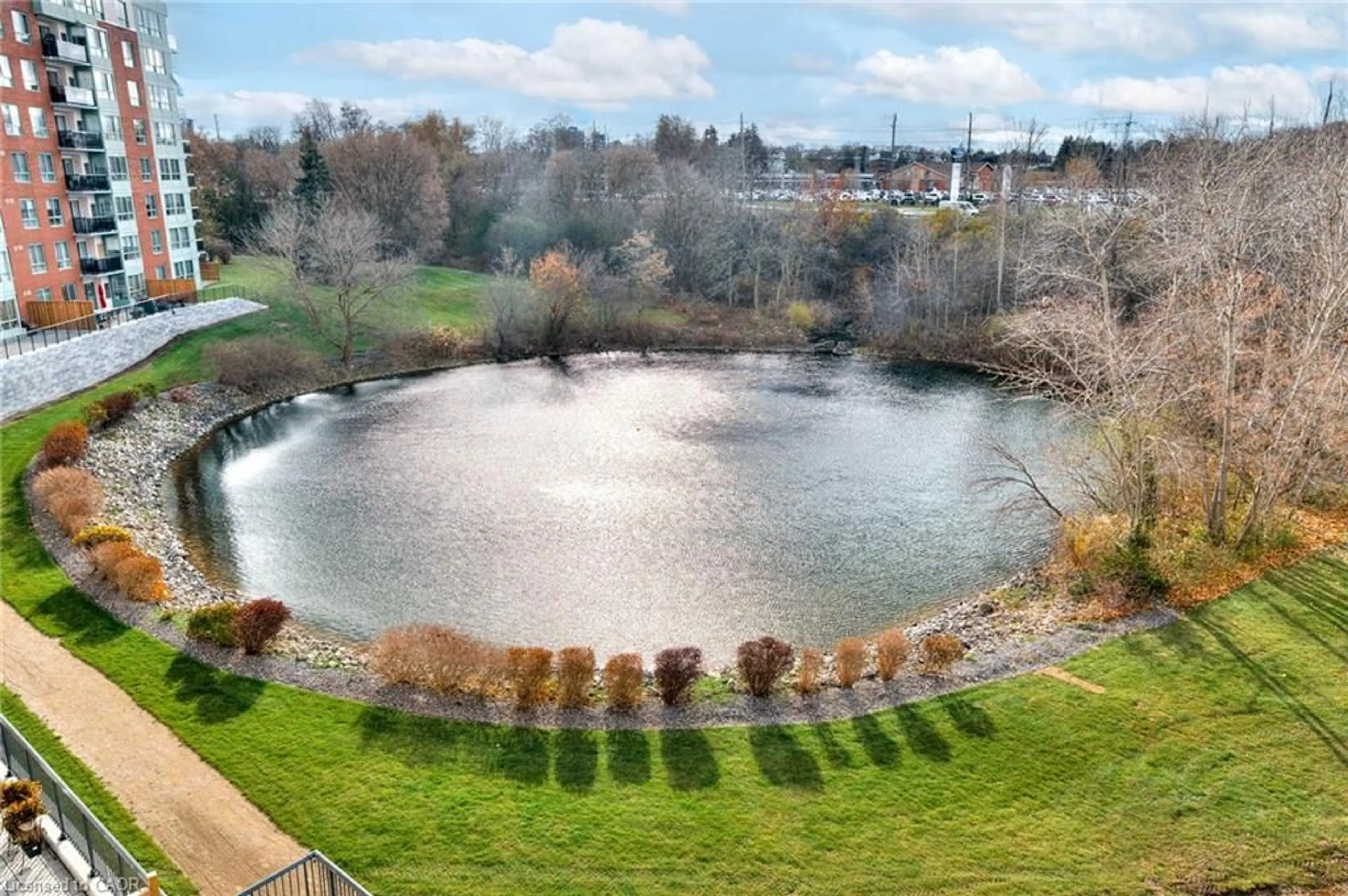 A pic from outside/outdoor area/front of a property/back of a property/a pic from drone, water/lake/river/ocean view for 30 Blue Springs Dr #413, Waterloo Ontario N2J 4T2