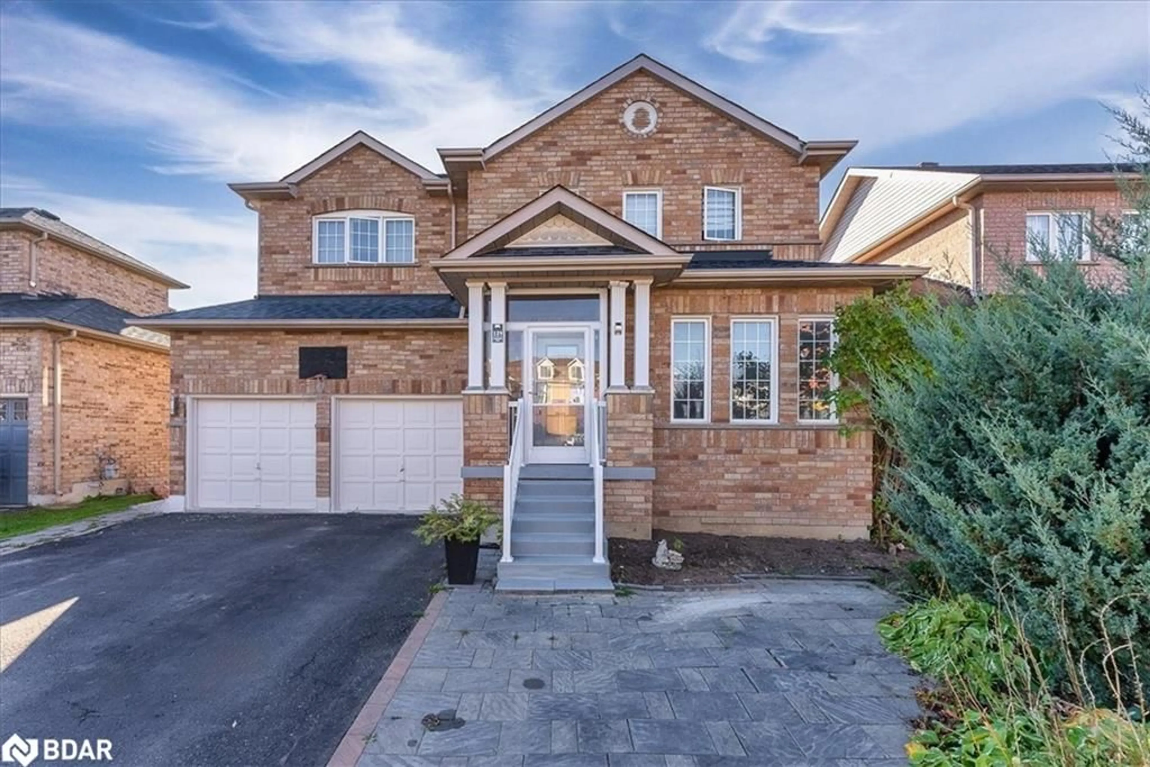 Home with brick exterior material, street for 129 Flagstone Way, Newmarket Ontario L3X 2Z8