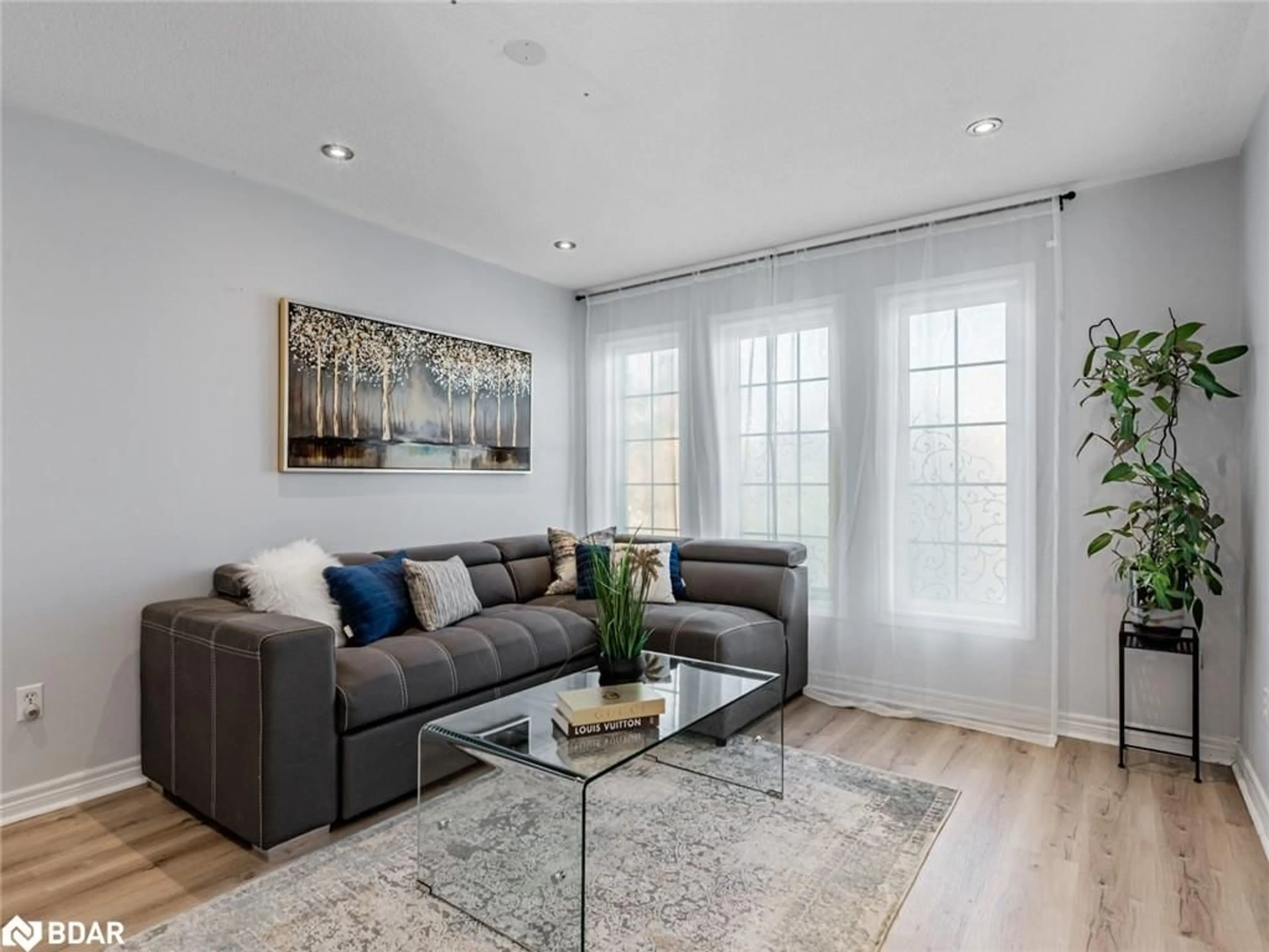 Living room with furniture, wood/laminate floor for 129 Flagstone Way, Newmarket Ontario L3X 2Z8