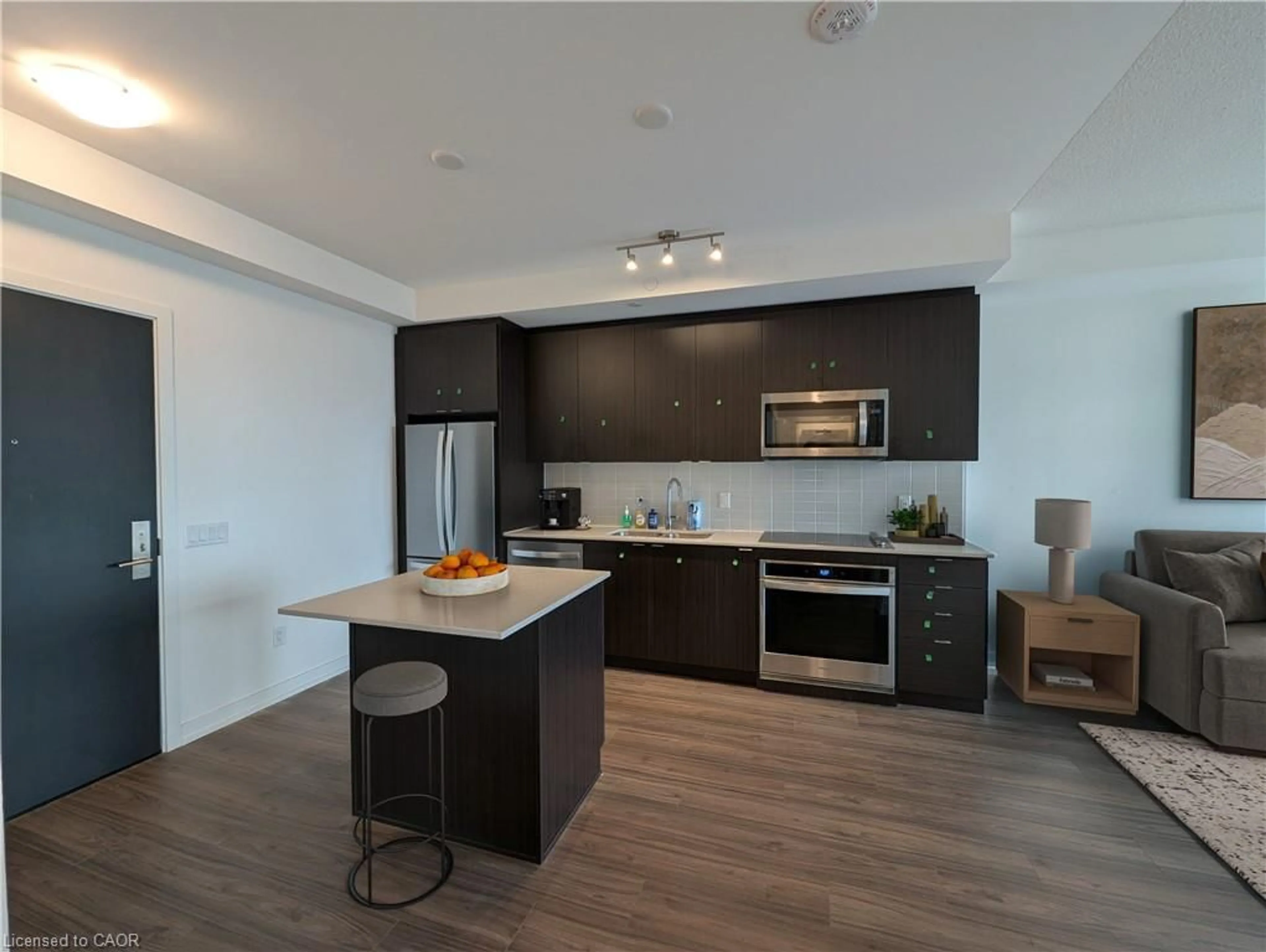Open concept kitchen, wood/laminate floor for 55 Duke St #2106, Kitchener Ontario N2H 0C9