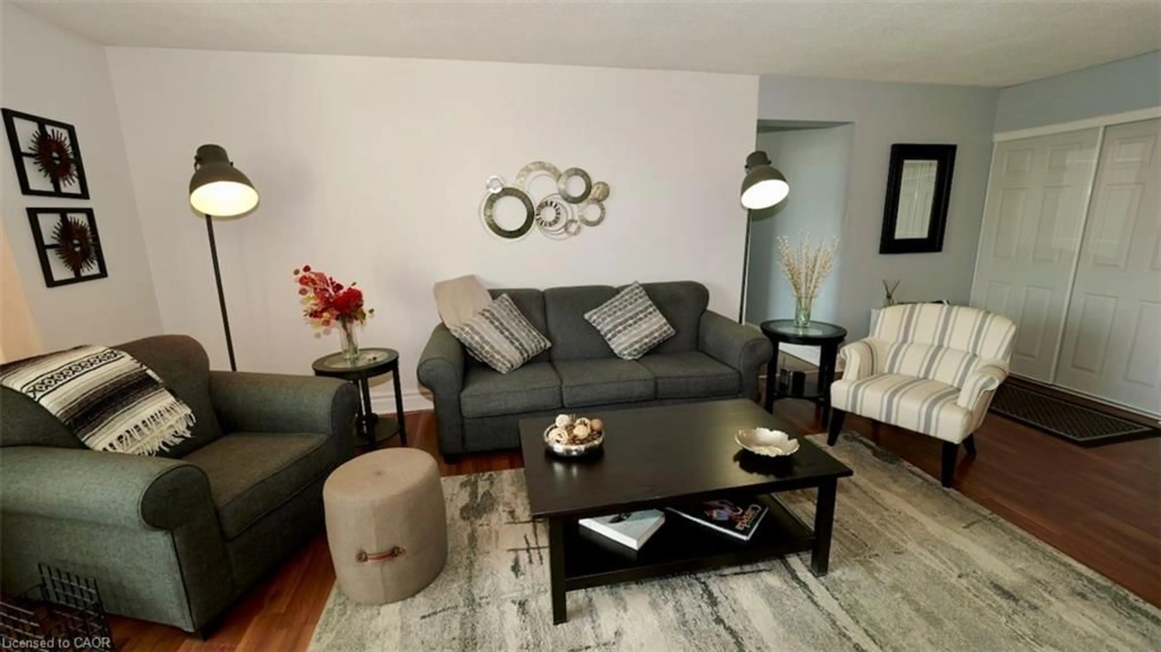 Living room with furniture, wood/laminate floor for 225 Harvard Pl #603, Waterloo Ontario N2J 4H4