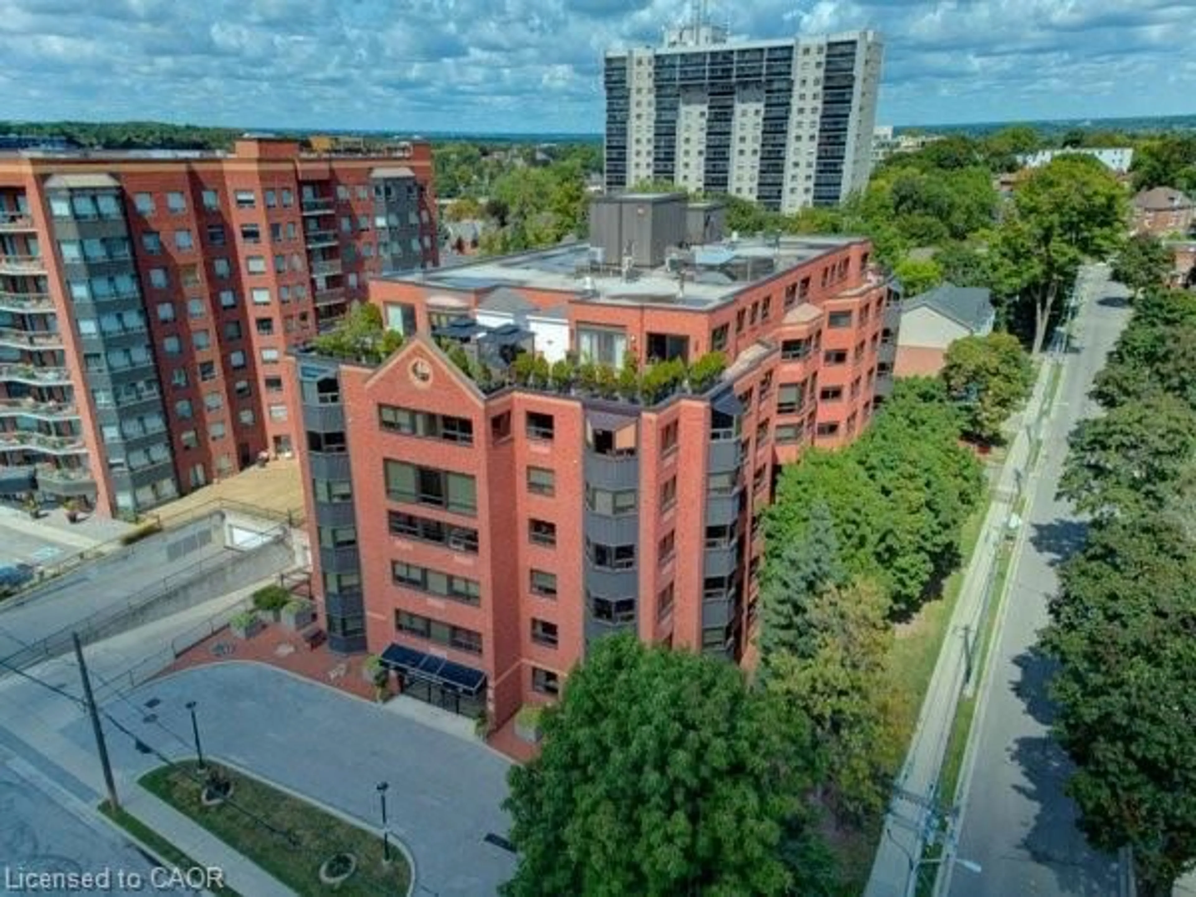 A pic from outside/outdoor area/front of a property/back of a property/a pic from drone, city buildings view from balcony for 20 Ellen St #303, Kitchener Ontario N2H 6R7