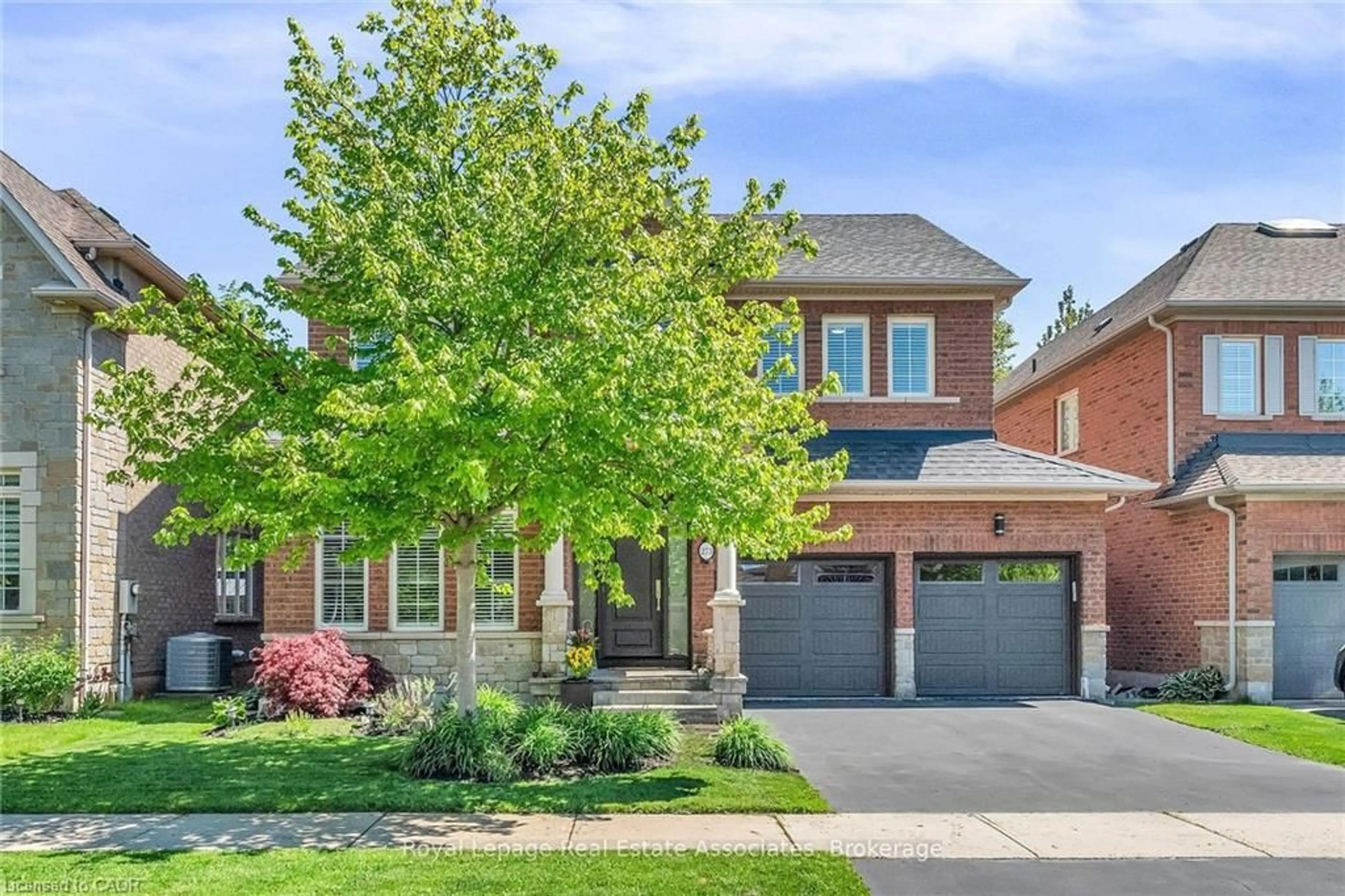 Home with brick exterior material, street for 273 Duskywing Way, Oakville Ontario L6L 6X5