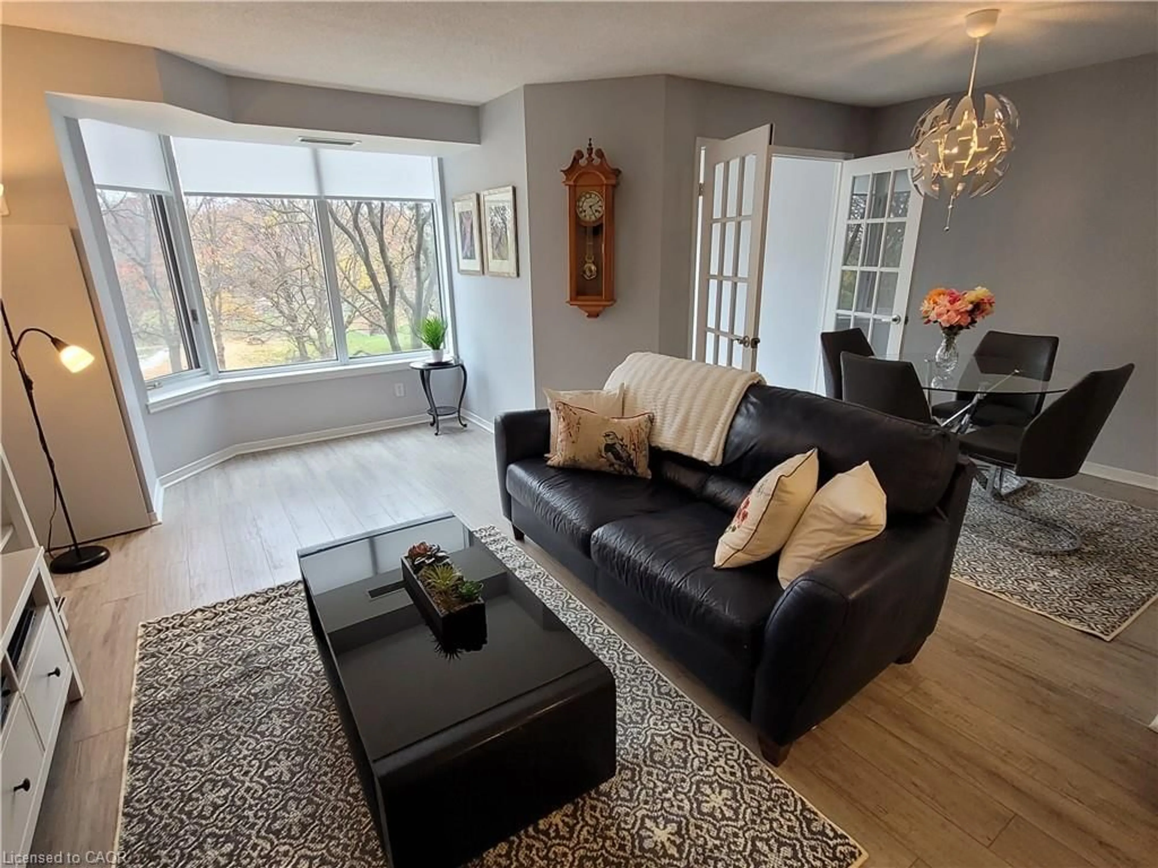 Living room with furniture, wood/laminate floor for 200 Limeridge Rd #308, Hamilton Ontario L9C 7M7