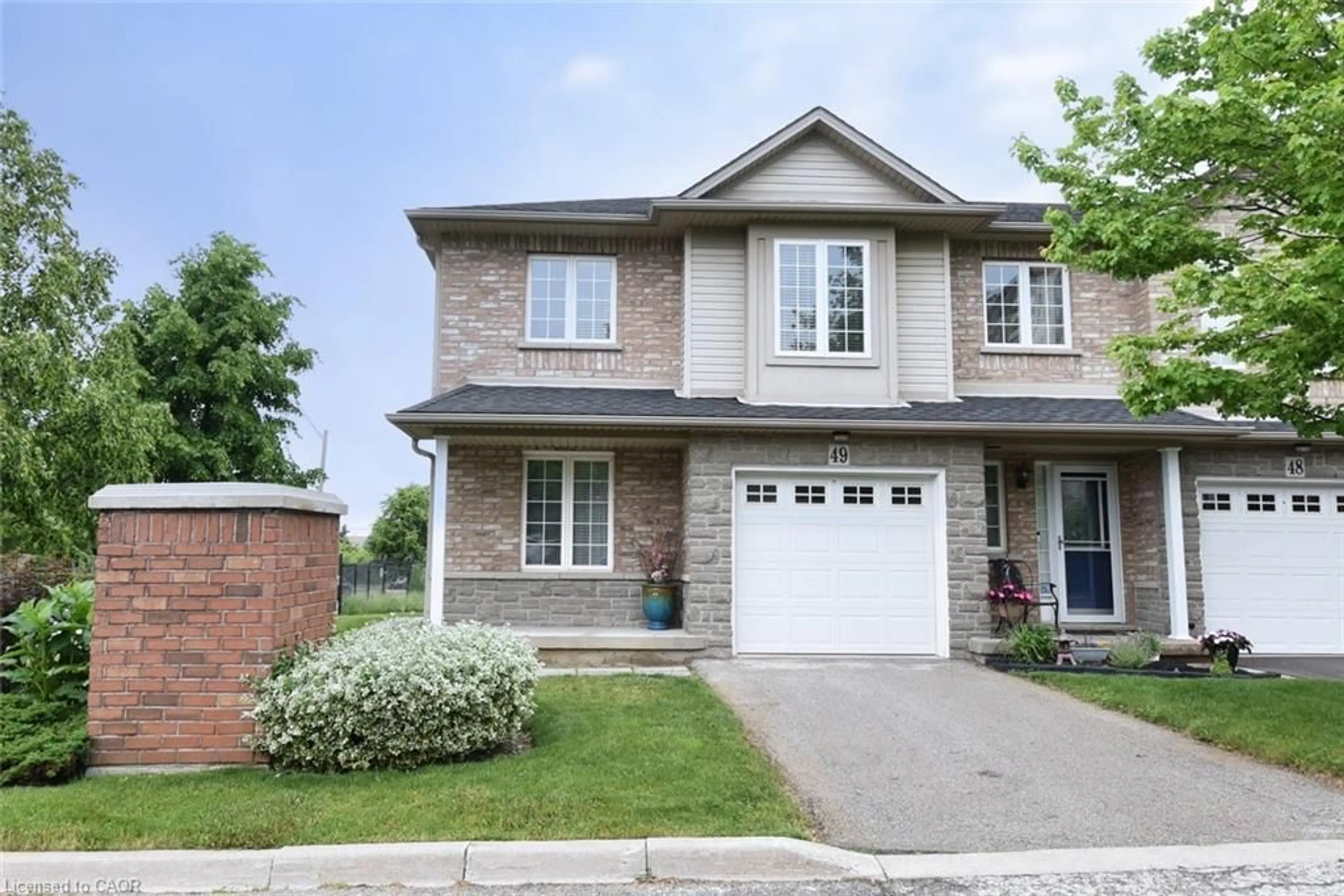 Home with brick exterior material, street for 7 Southside Pl #49, Hamilton Ontario L9C 7W6