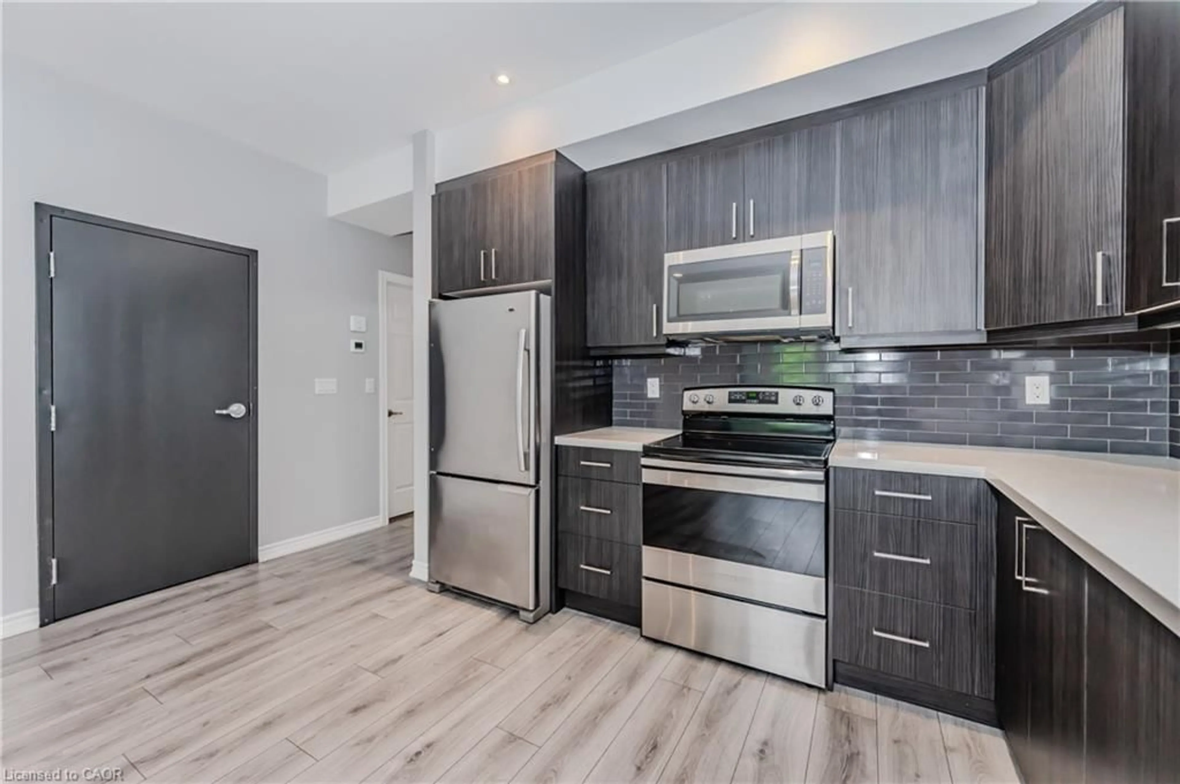 Open concept kitchen, wood/laminate floor for 17 Mary St #3, Kitchener Ontario N2H 3P9