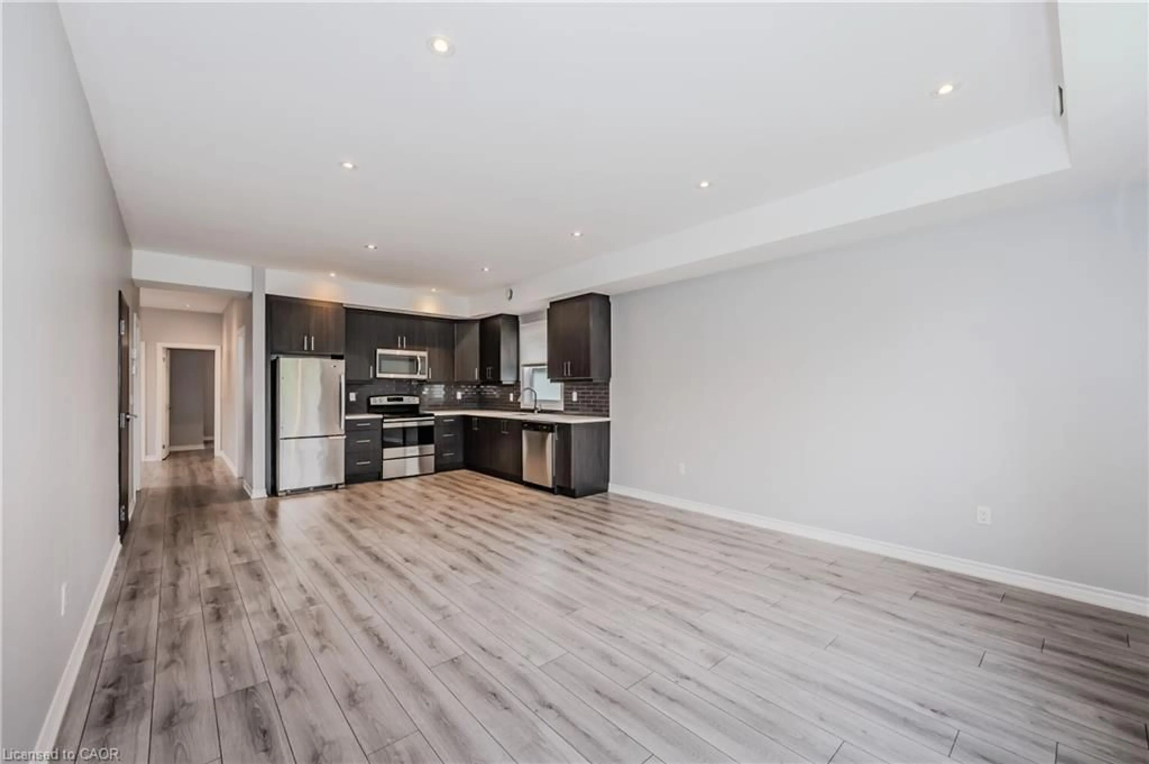 Open concept kitchen, wood/laminate floor for 17 Mary St #3, Kitchener Ontario N2H 3P9