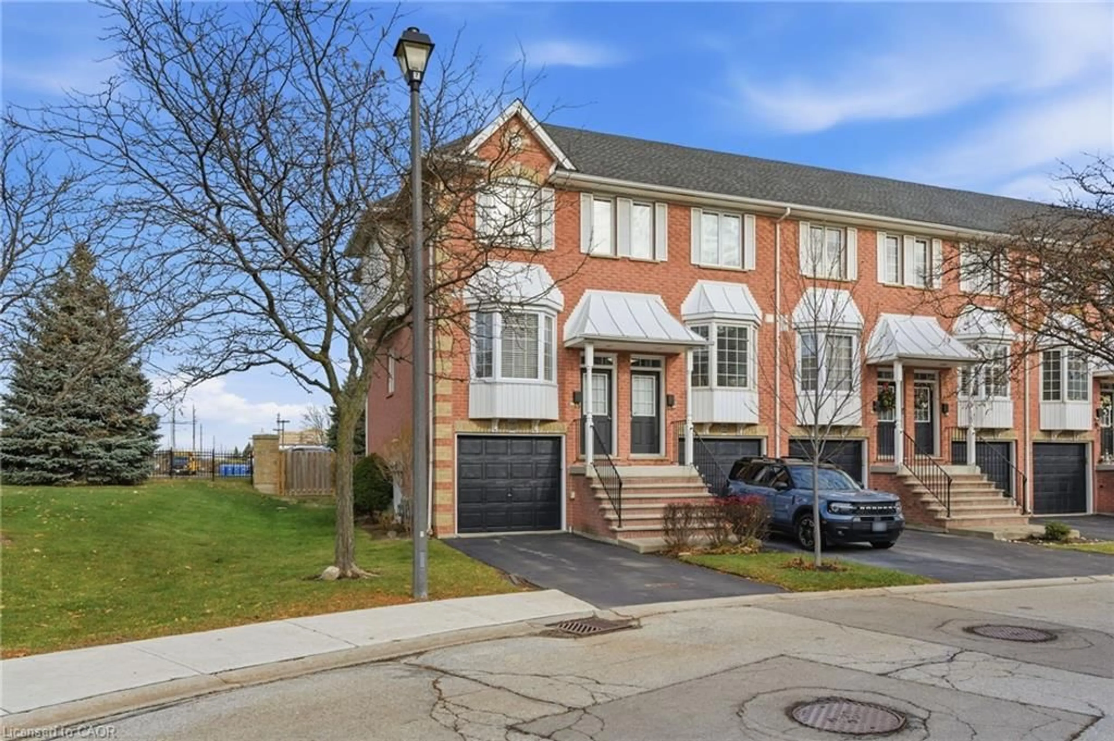 Home with brick exterior material, street for 3480 Upper Middle Rd #123, Burlington Ontario L7M 4R8