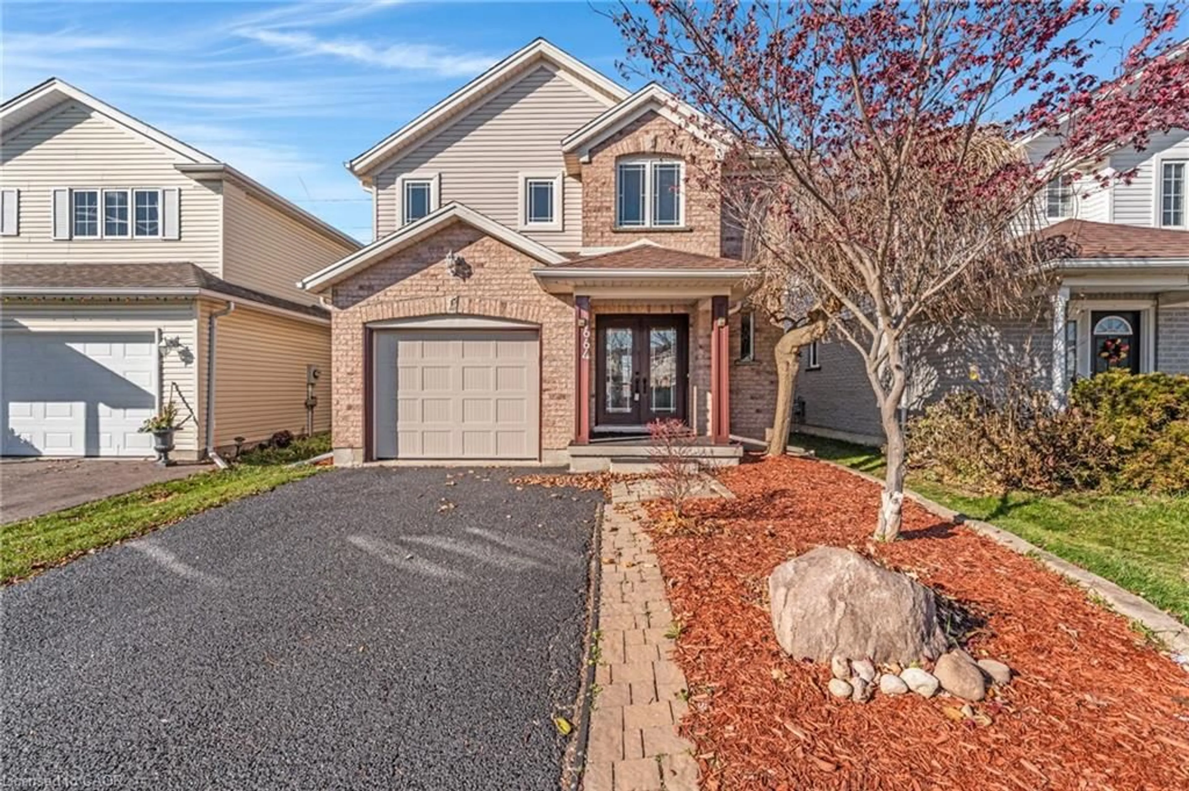 Home with brick exterior material, street for 664 Brandenburg Blvd, Waterloo Ontario N2T 2V4