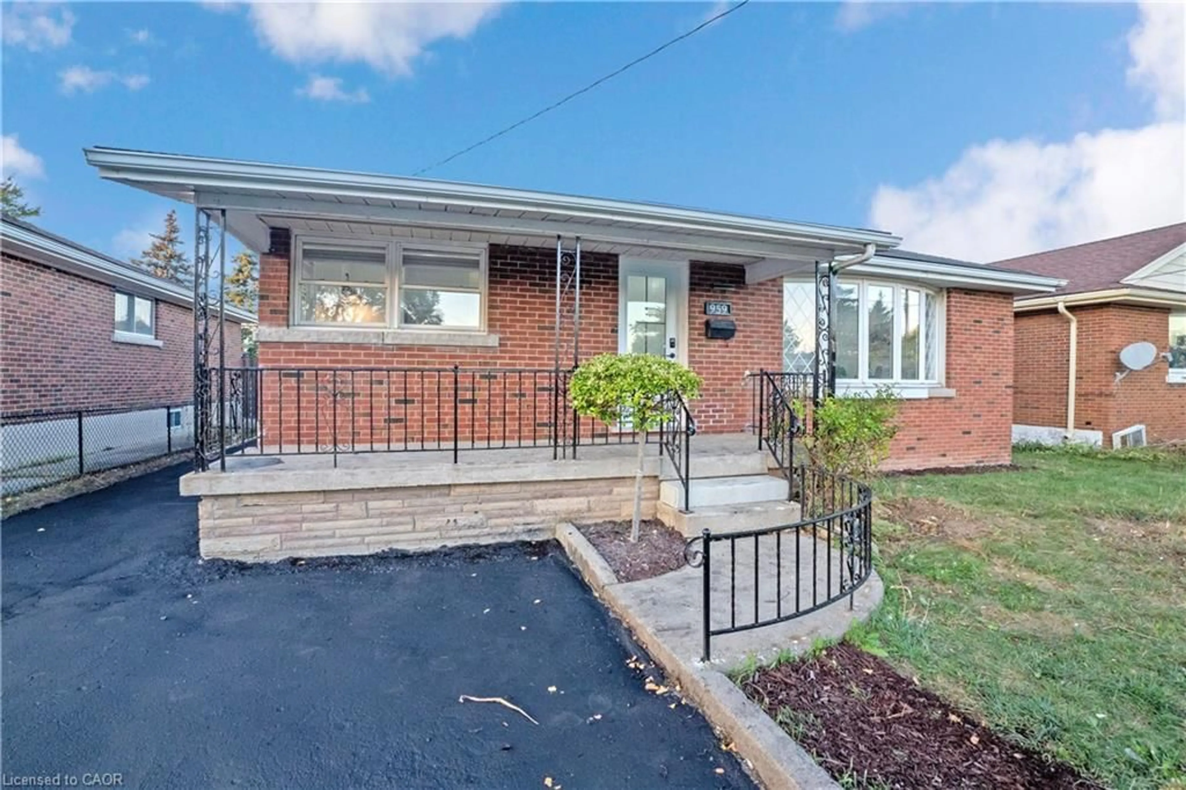 Home with brick exterior material, street for 959 Mohawk Rd, Hamilton Ontario L8T 2R9