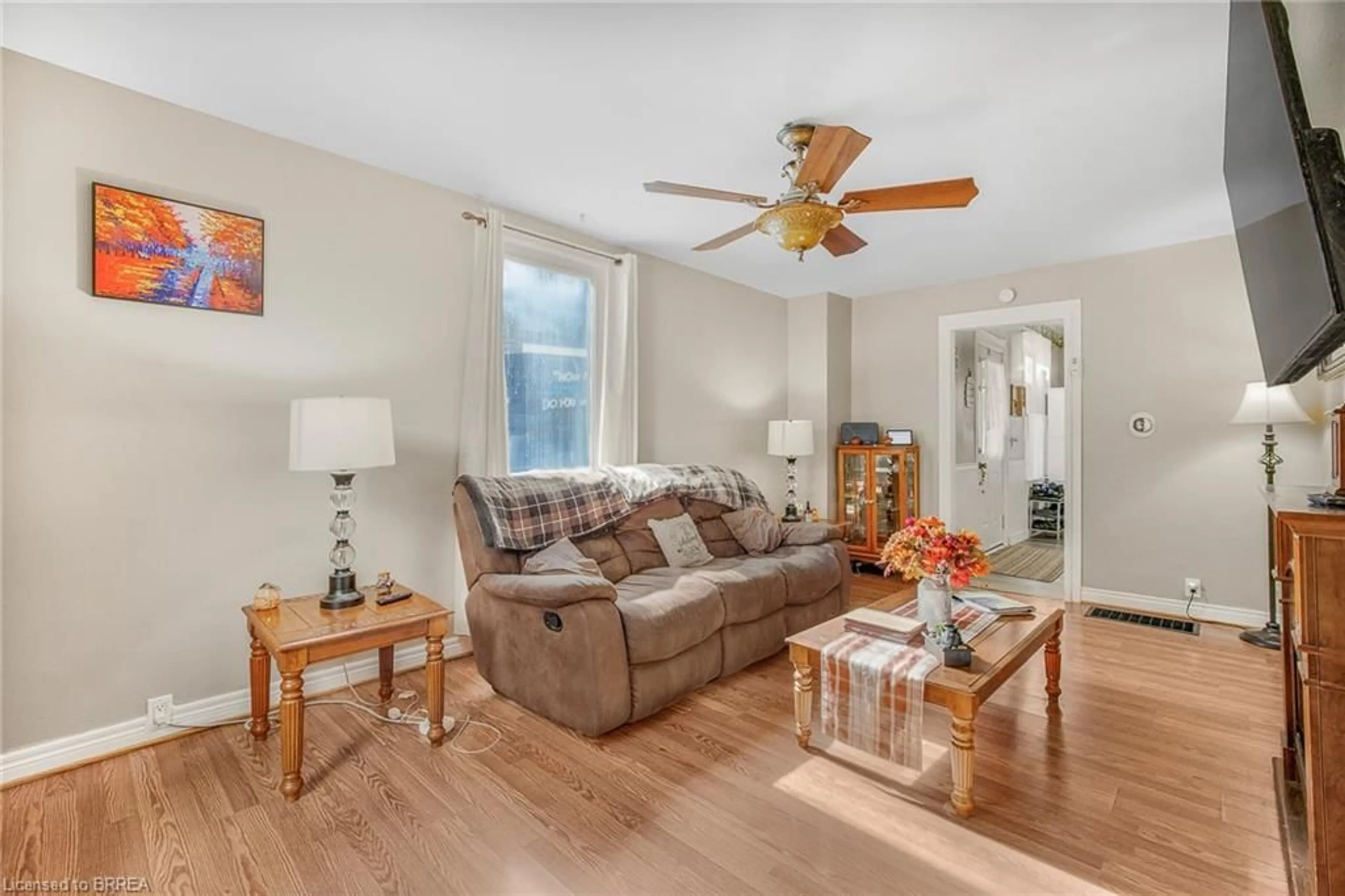 Living room with furniture, wood/laminate floor for 9 Superior St, Brantford Ontario N3S 2J9