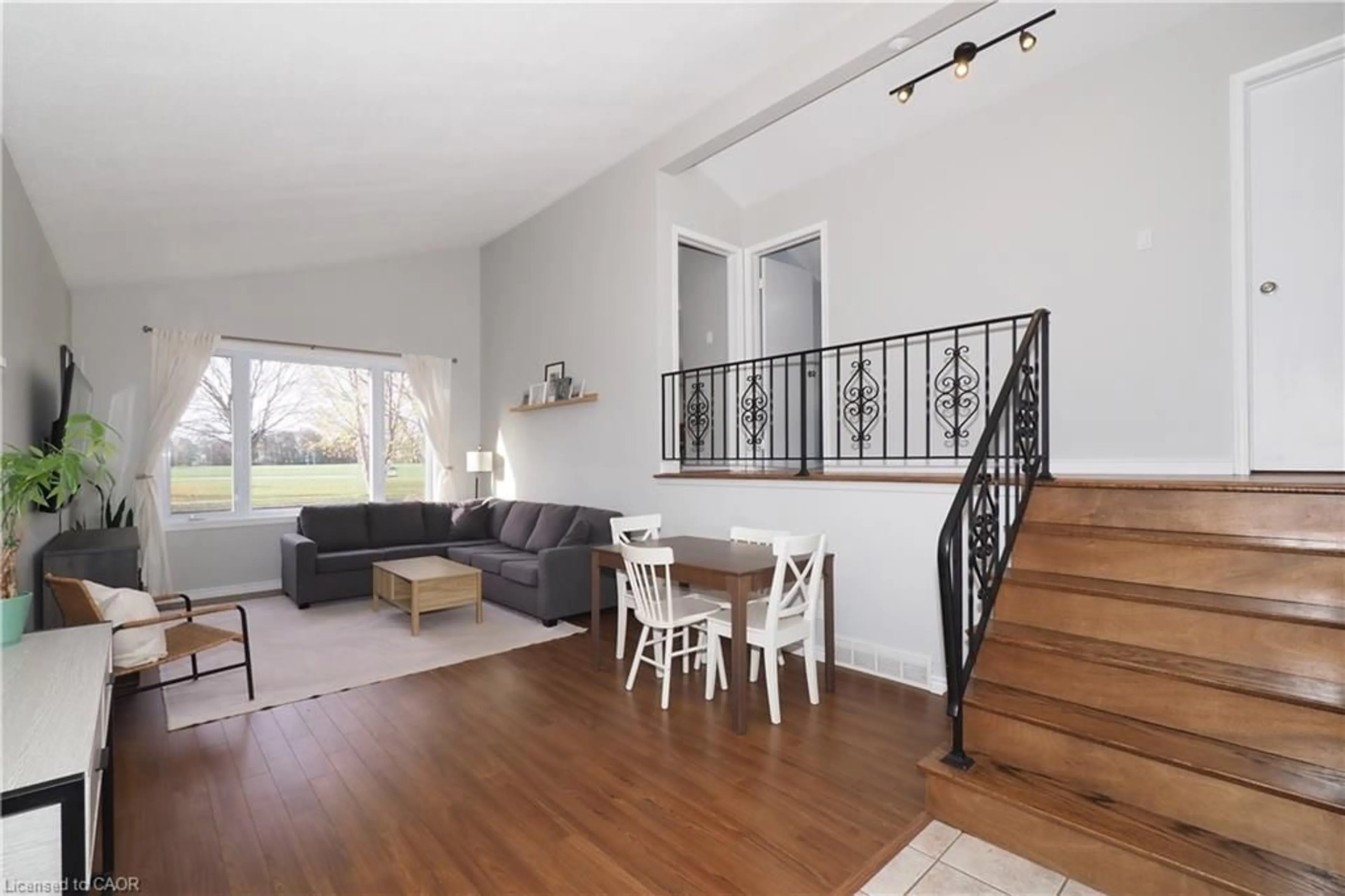 Living room with furniture, wood/laminate floor for 132 Montcalm Dr, Kitchener Ontario N2B 2R5