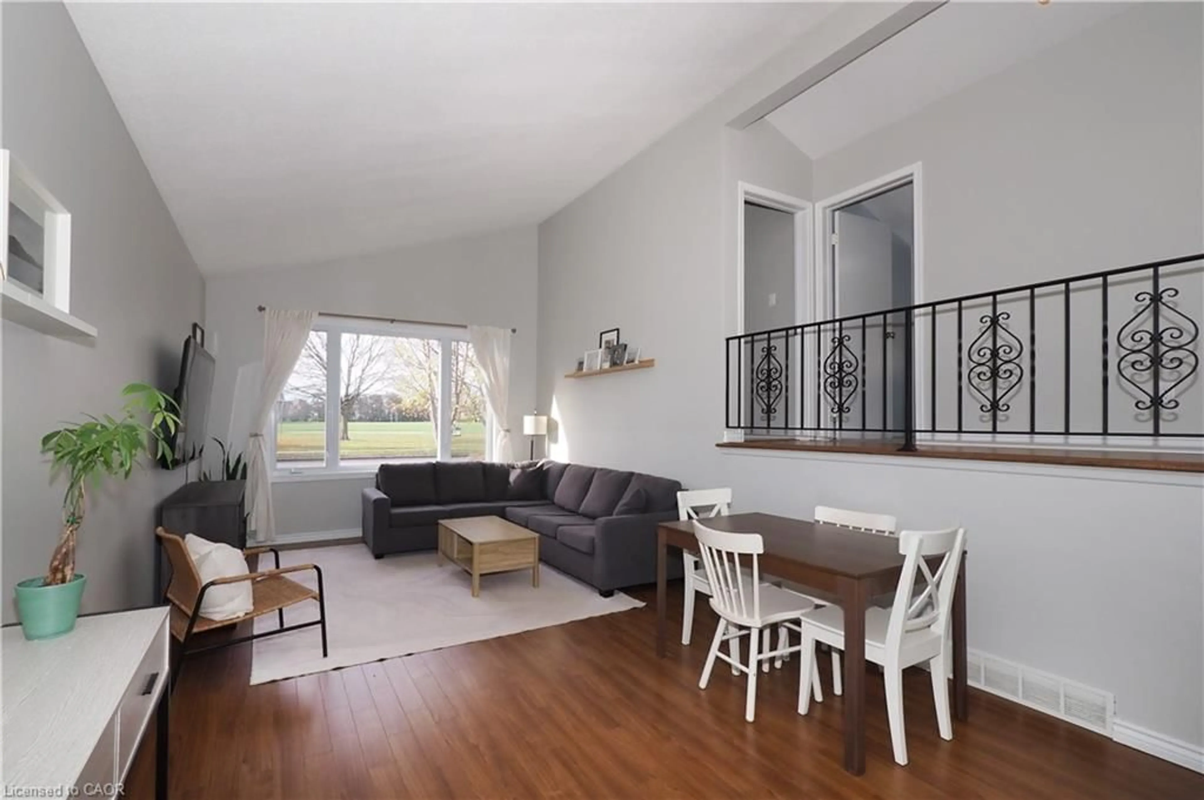 Living room with furniture, wood/laminate floor for 132 Montcalm Dr, Kitchener Ontario N2B 2R5