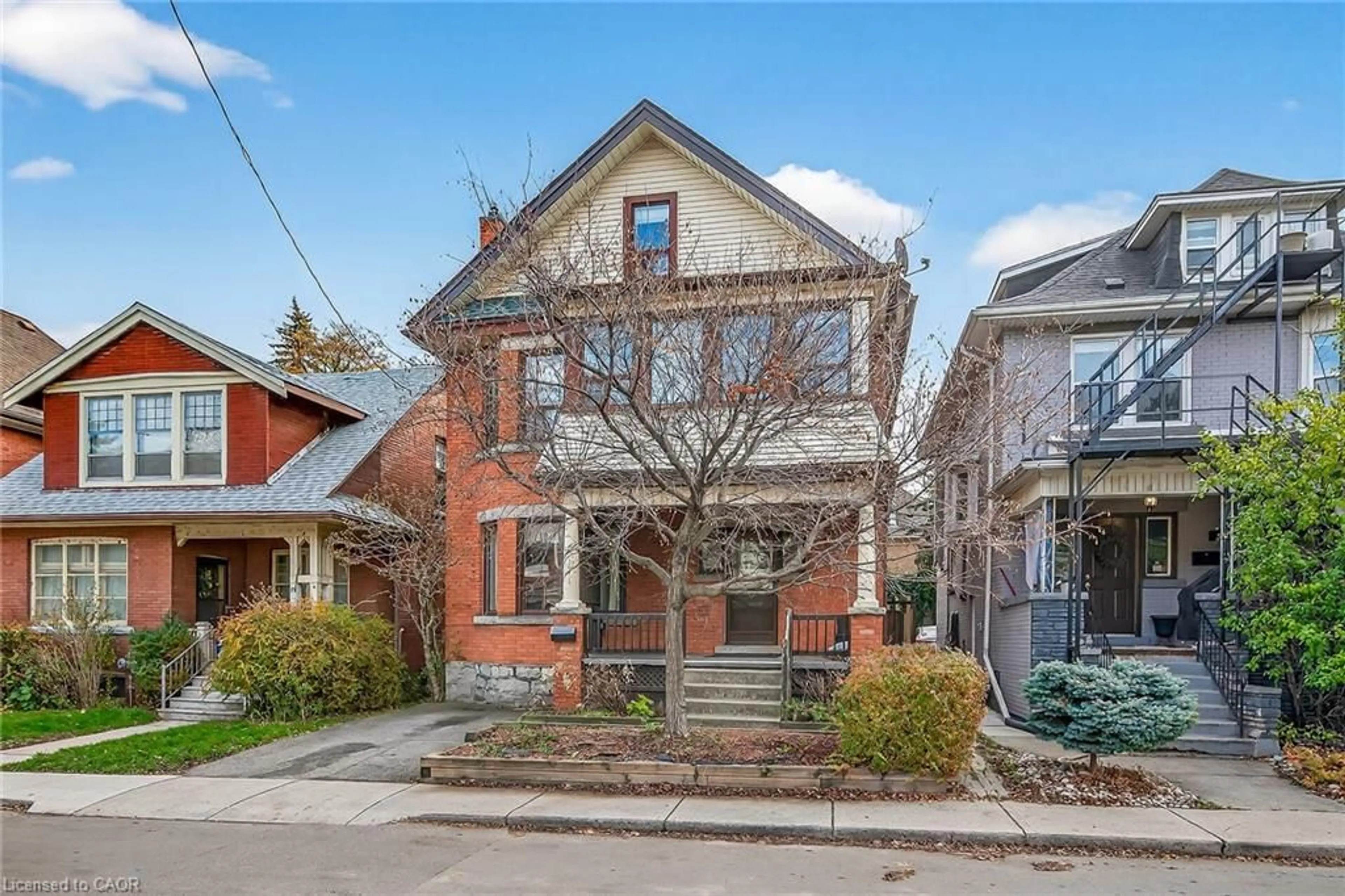 Home with brick exterior material, street for 91 Spadina Ave, Hamilton Ontario L8M 2X4