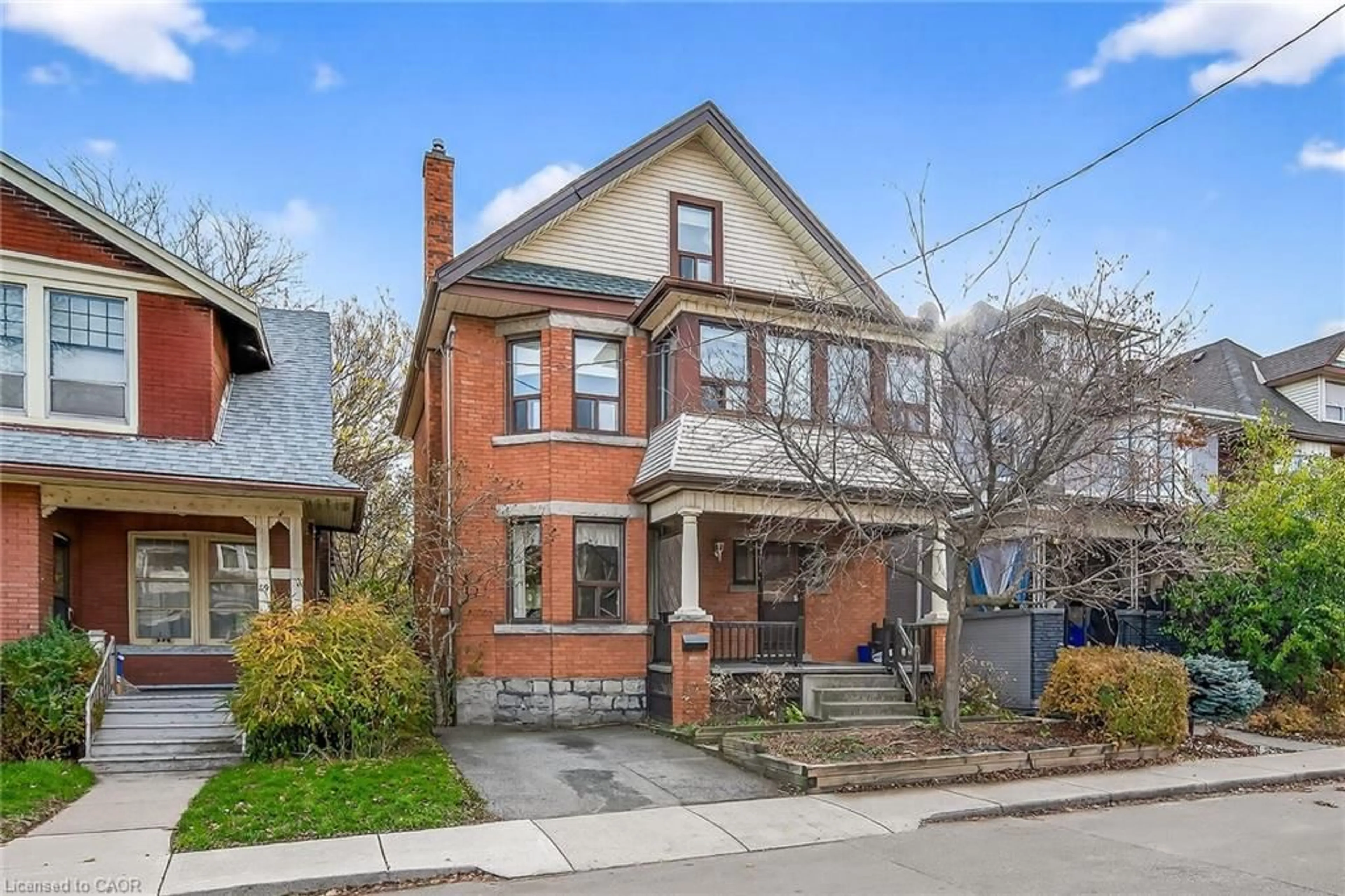 Home with brick exterior material, street for 91 Spadina Ave, Hamilton Ontario L8M 2X4