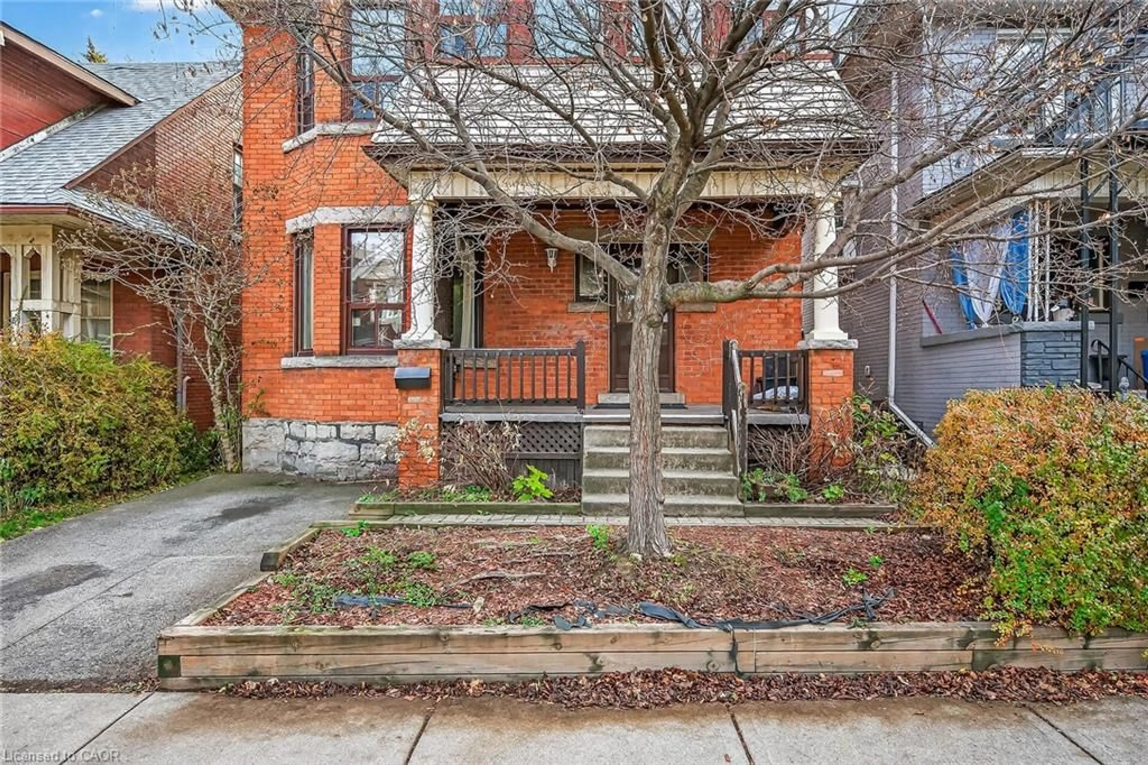 Home with brick exterior material, street for 91 Spadina Ave, Hamilton Ontario L8M 2X4