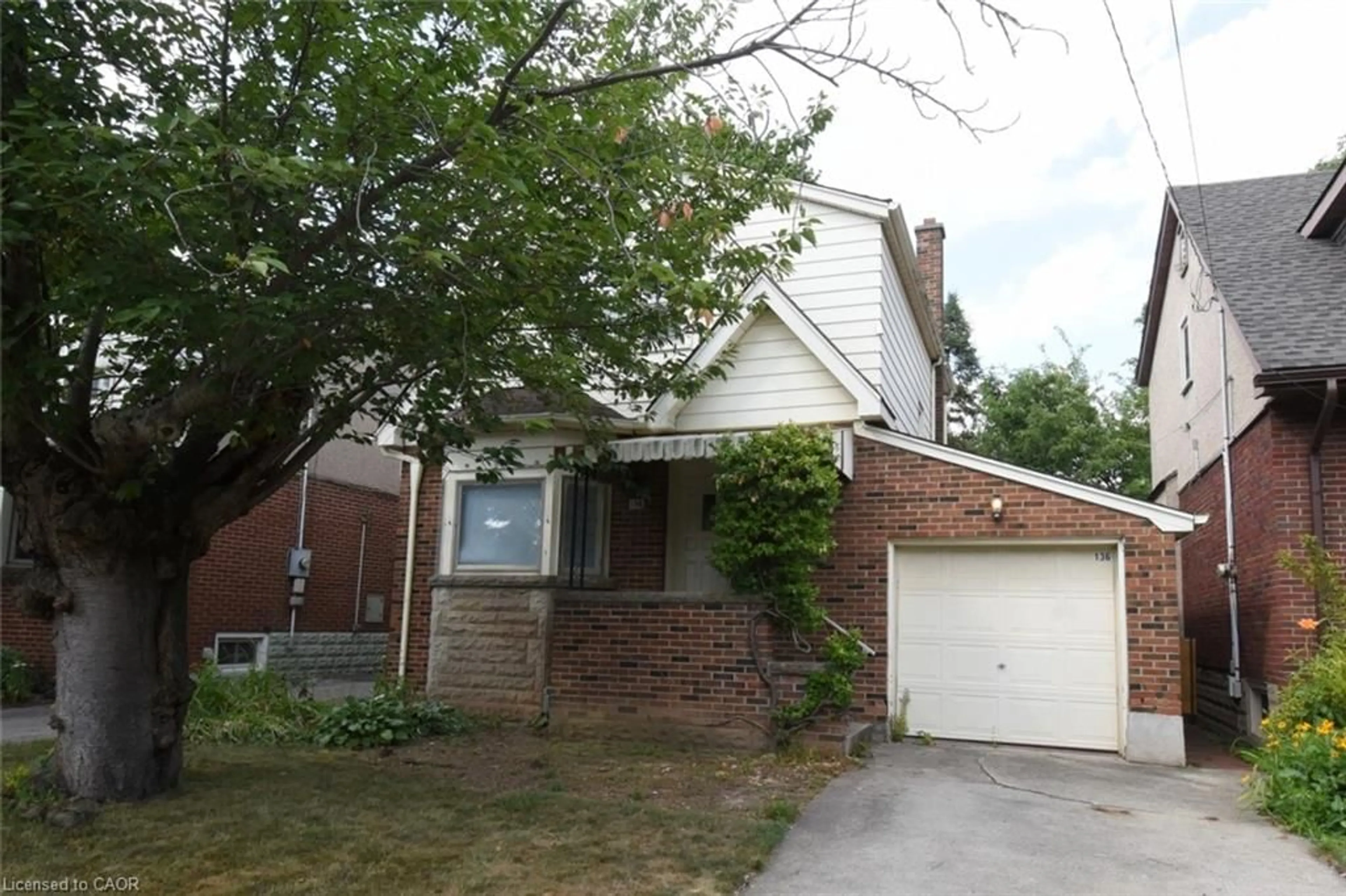 Home with brick exterior material, street for 136 Glen Rd, Hamilton Ontario L8S 3M9