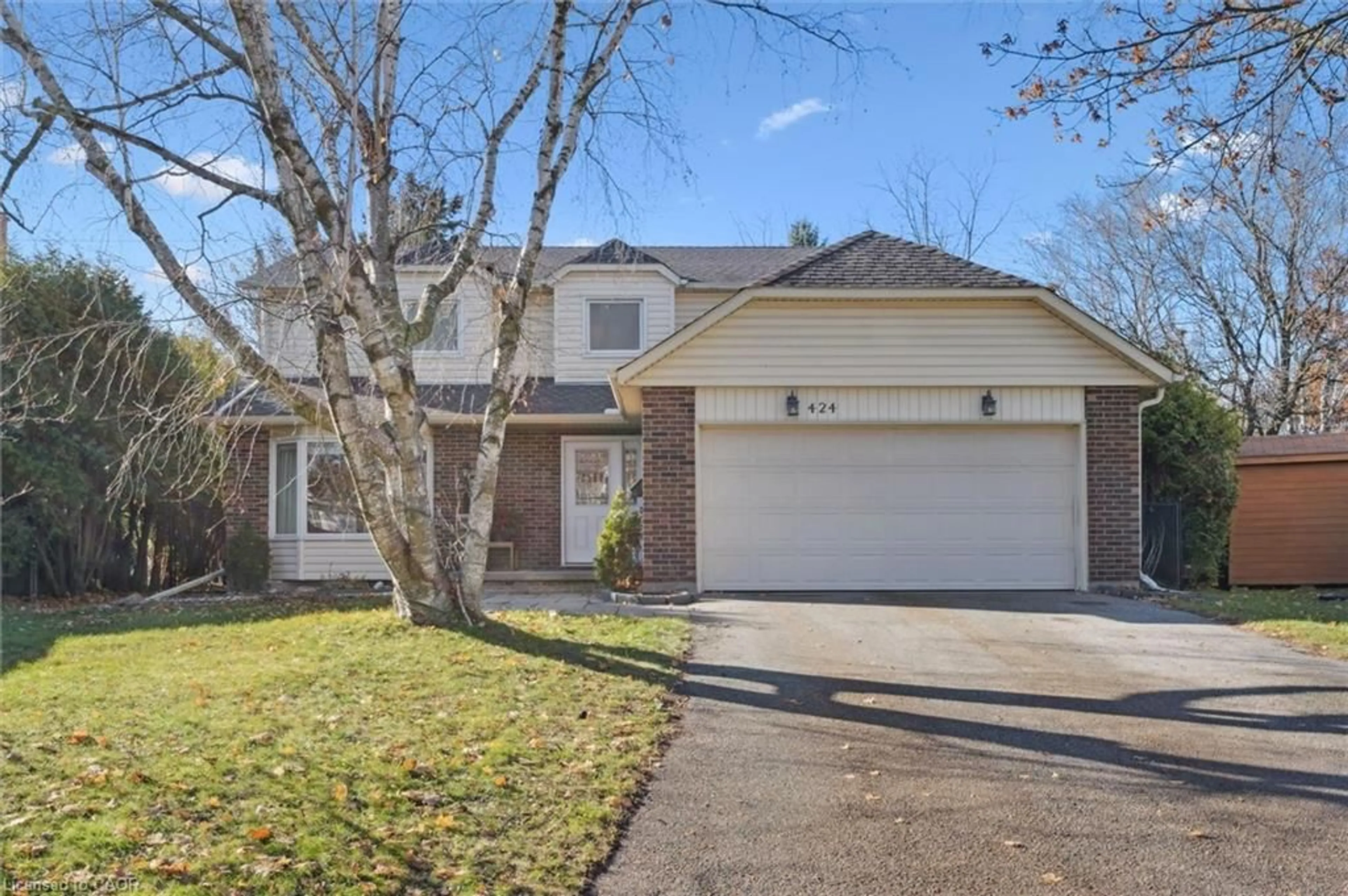 Home with brick exterior material, street for 424 Clairbrook Cres, Waterloo Ontario N2L 5V7