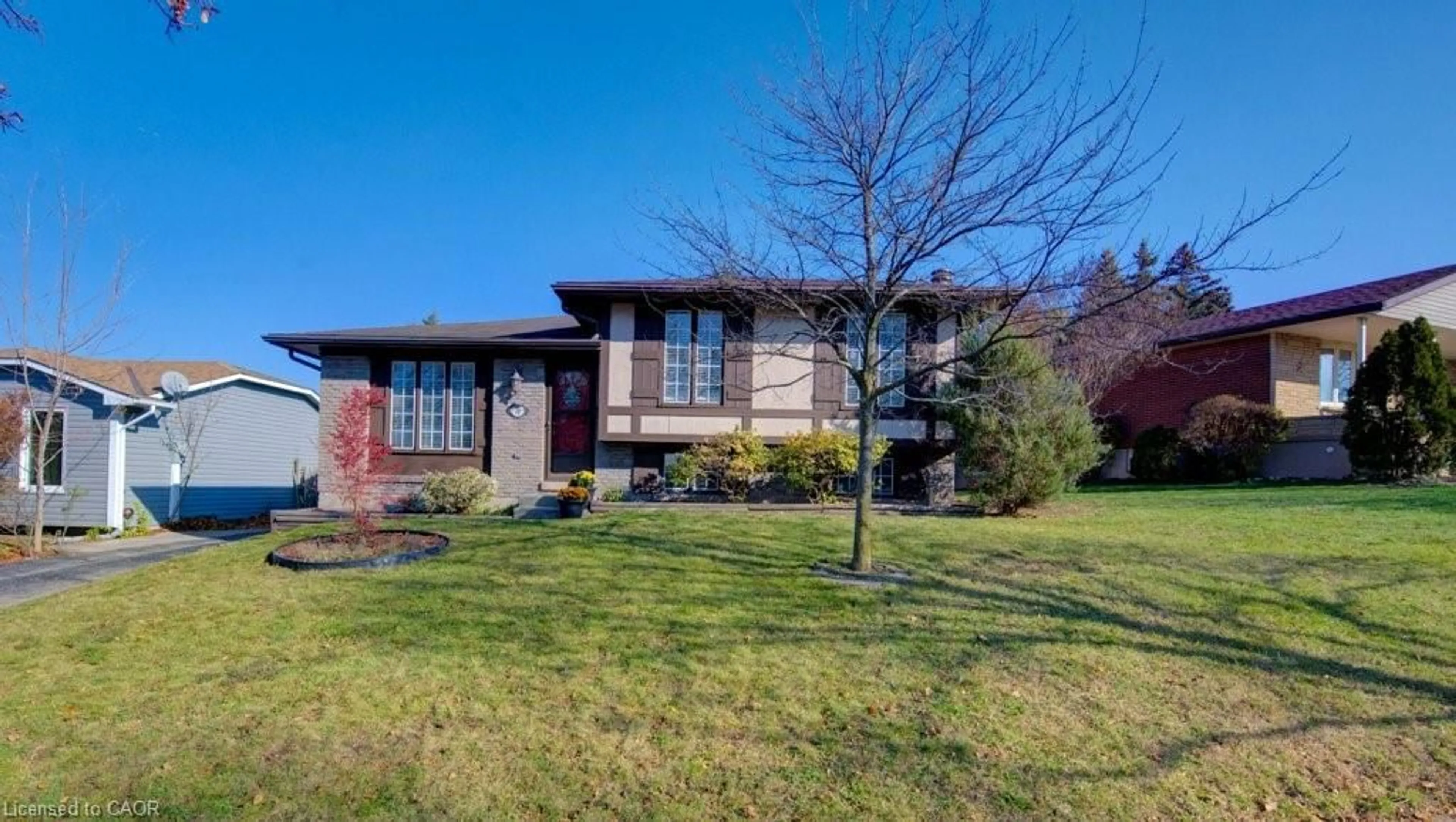 Home with brick exterior material, street for 76 Devonglen Dr, Kitchener Ontario N2E 2C5