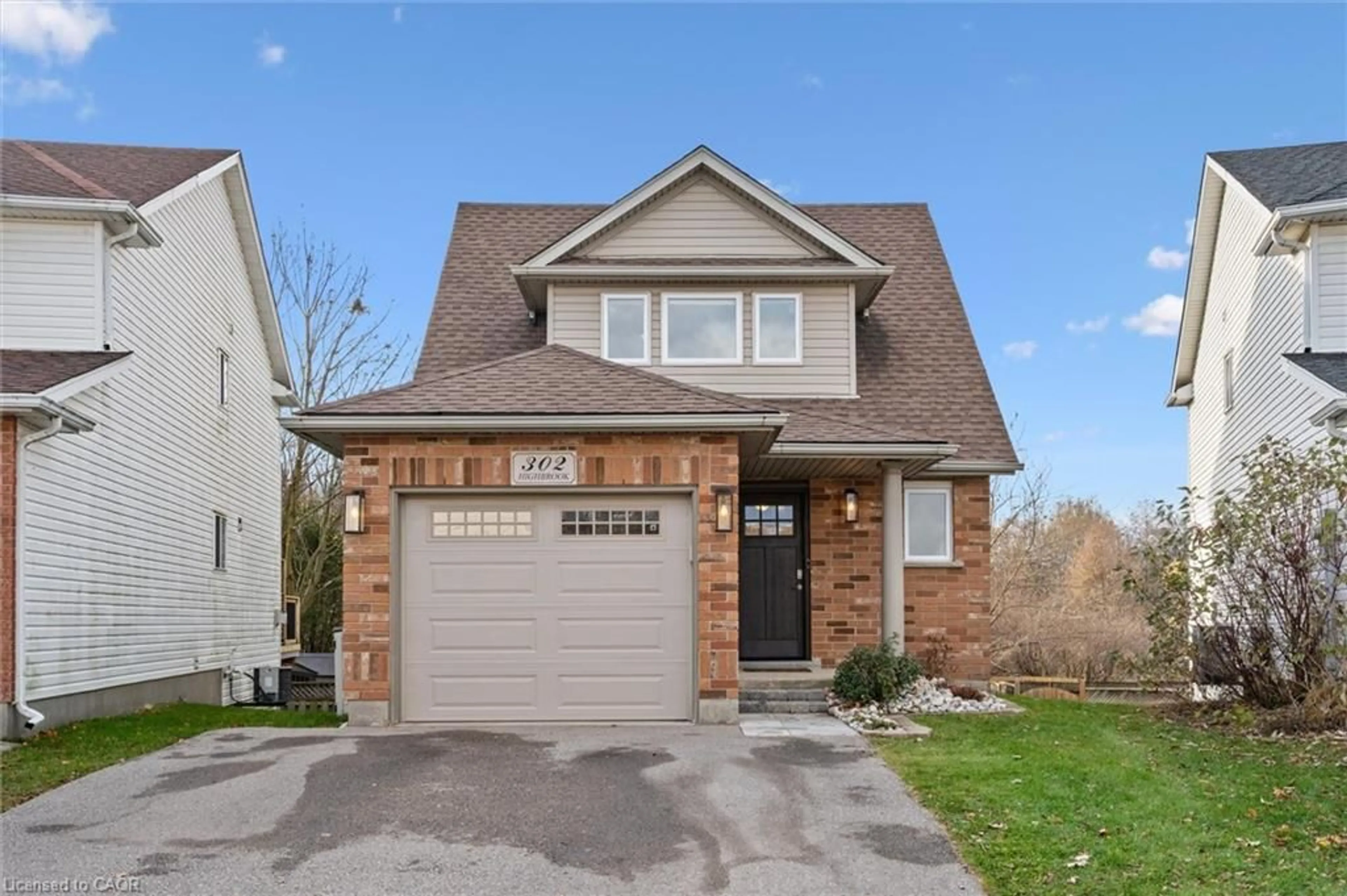 Home with brick exterior material, street for 302 Highbrook Cres, Kitchener Ontario N2E 3S6