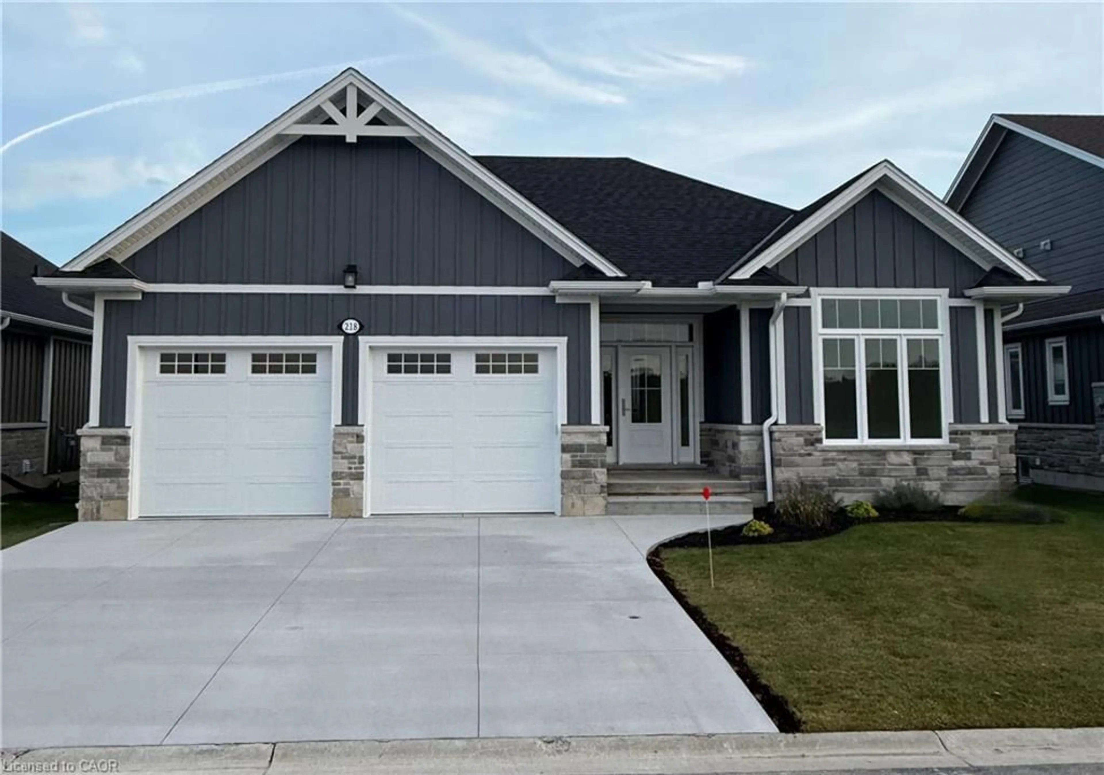 Home with vinyl exterior material, street for 218 Schooner Dr, Port Dover Ontario N0A 1N3