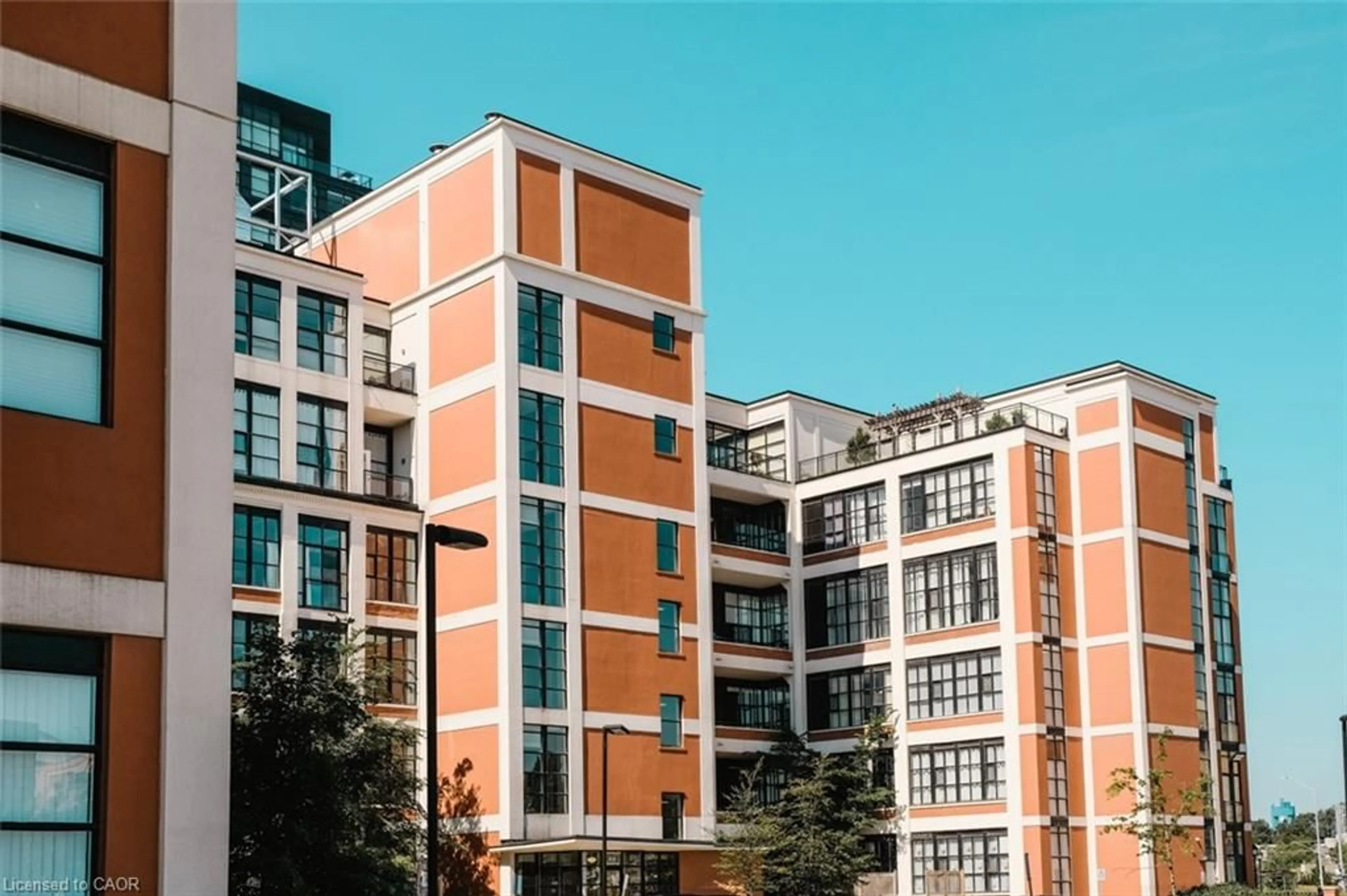 Home with brick exterior material, city buildings view from balcony for 404 King St #116, Kitchener Ontario N2G 2L5