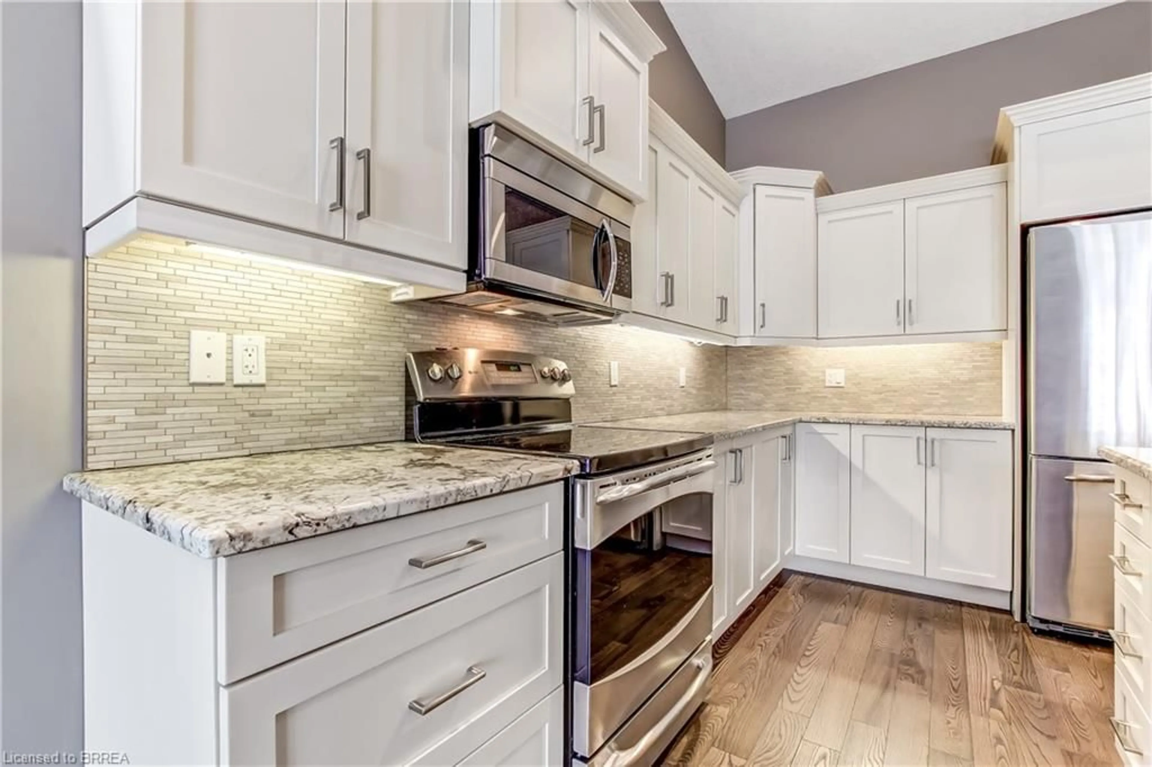 Open concept kitchen, ceramic/tile floor for 26 Reid St #8, St. George Ontario N0E 1N0